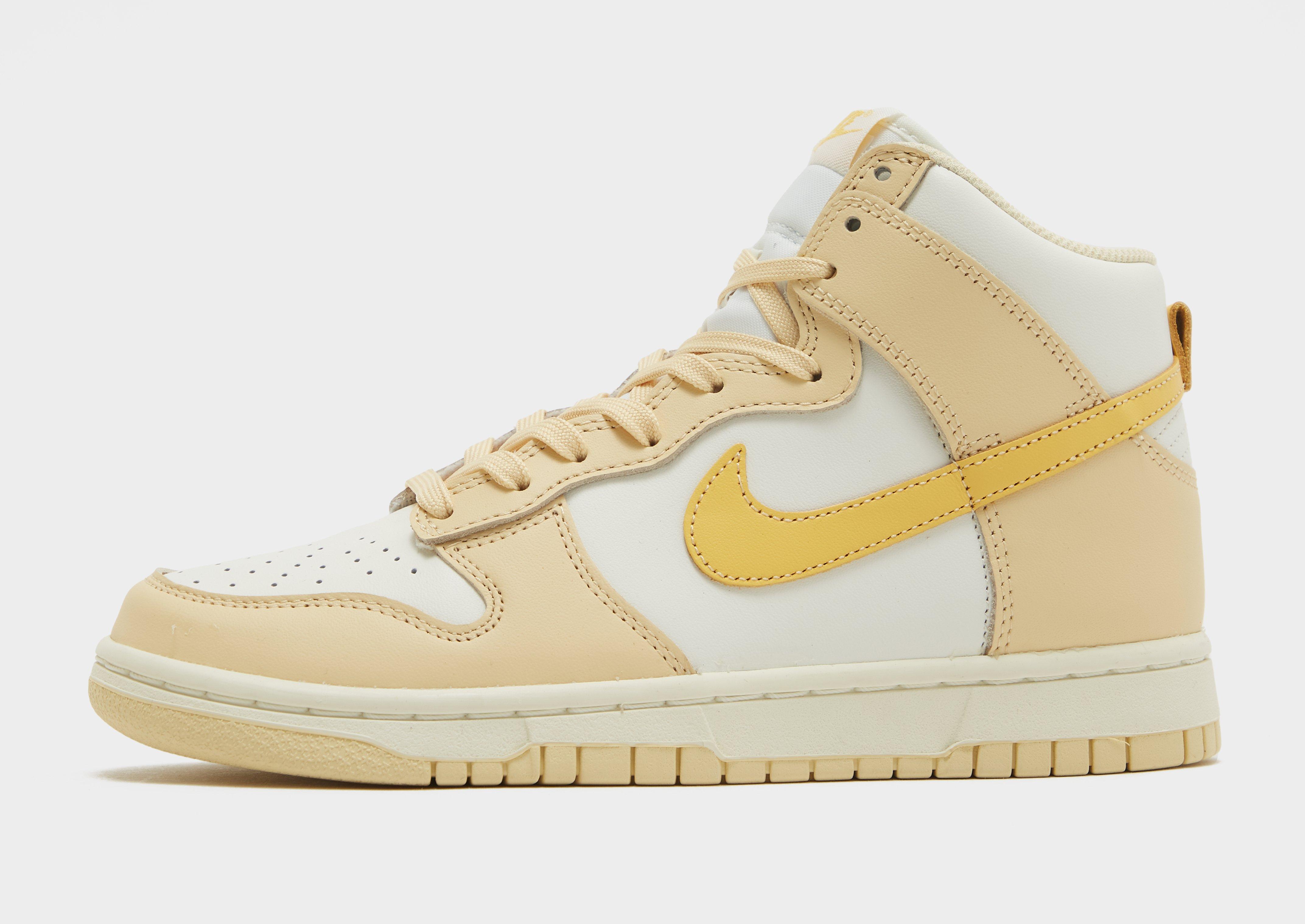 Nike's Dunk High Steps Out In A White And Beige Outfit