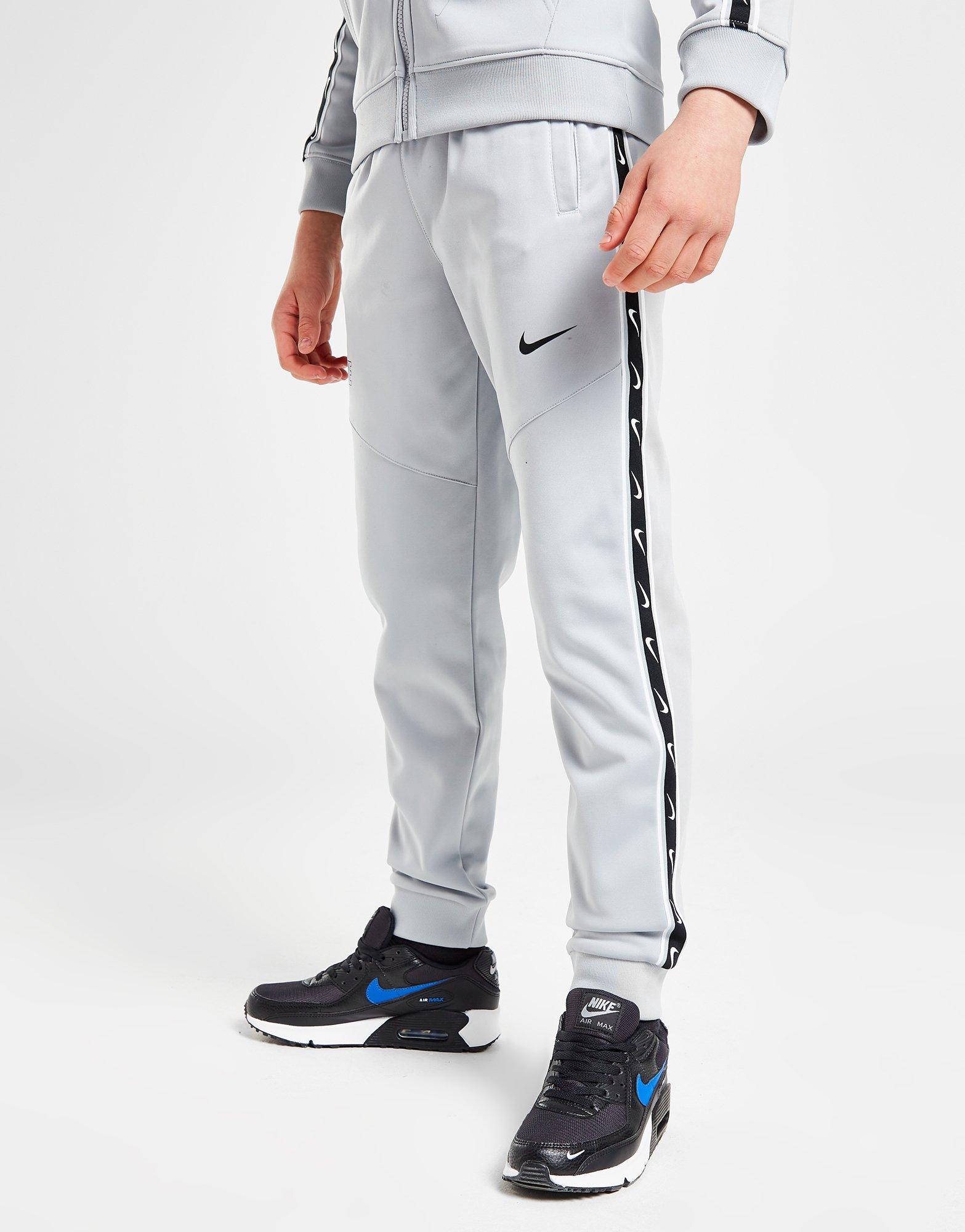 Nike tape track pants grey hotsell