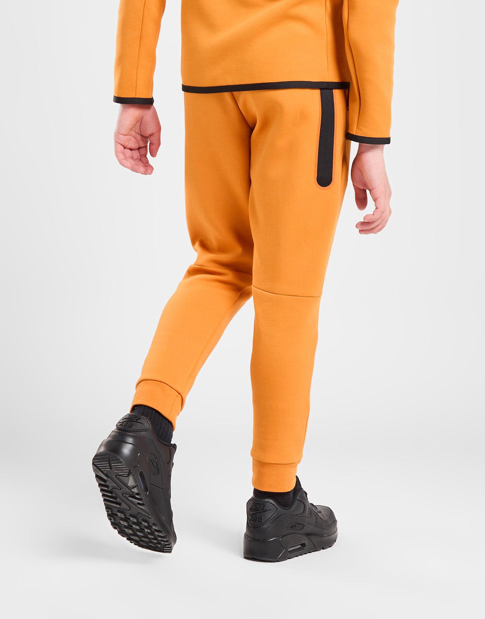 Orange nike fleece discount pants