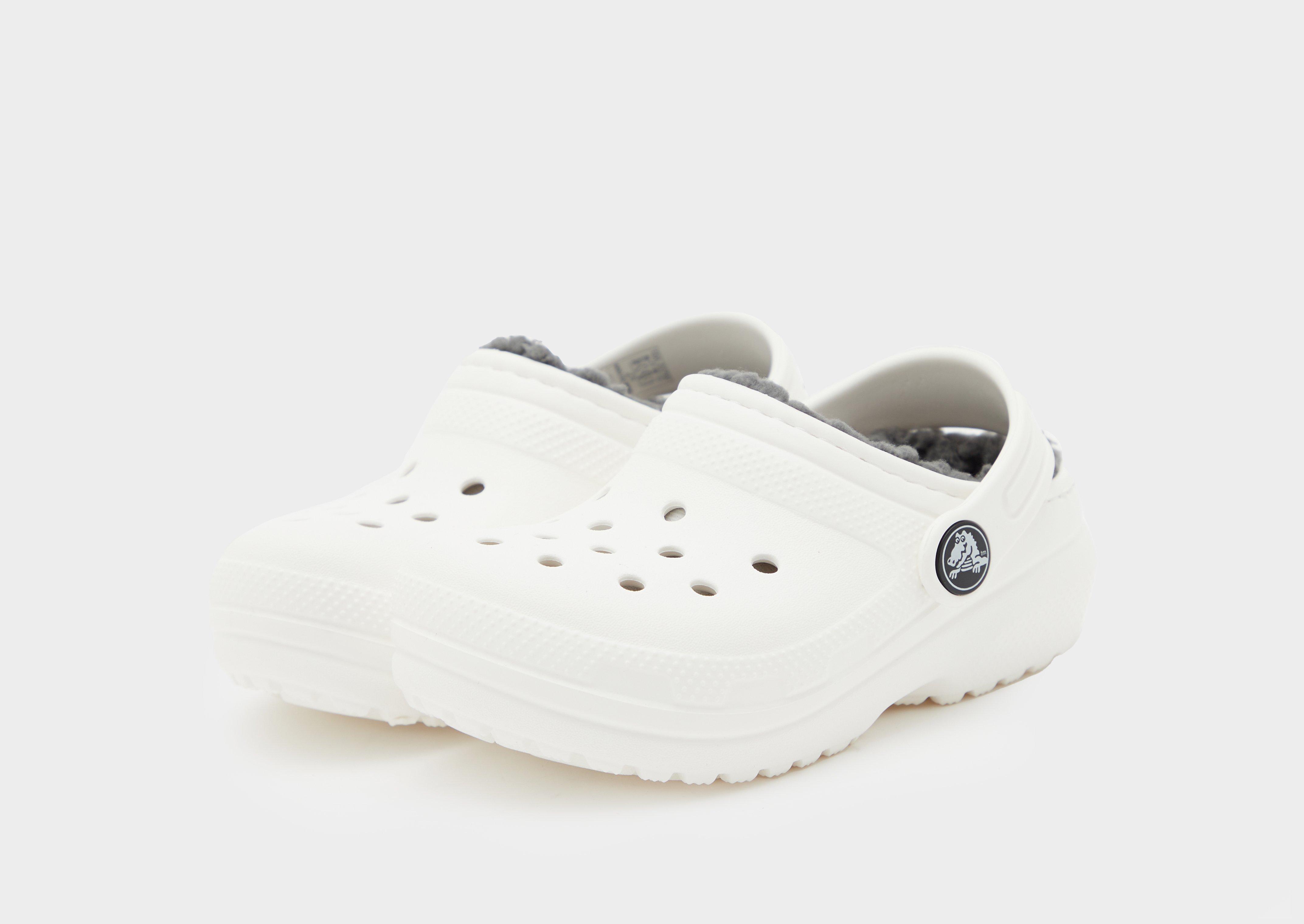 All white 2025 crocs with fur