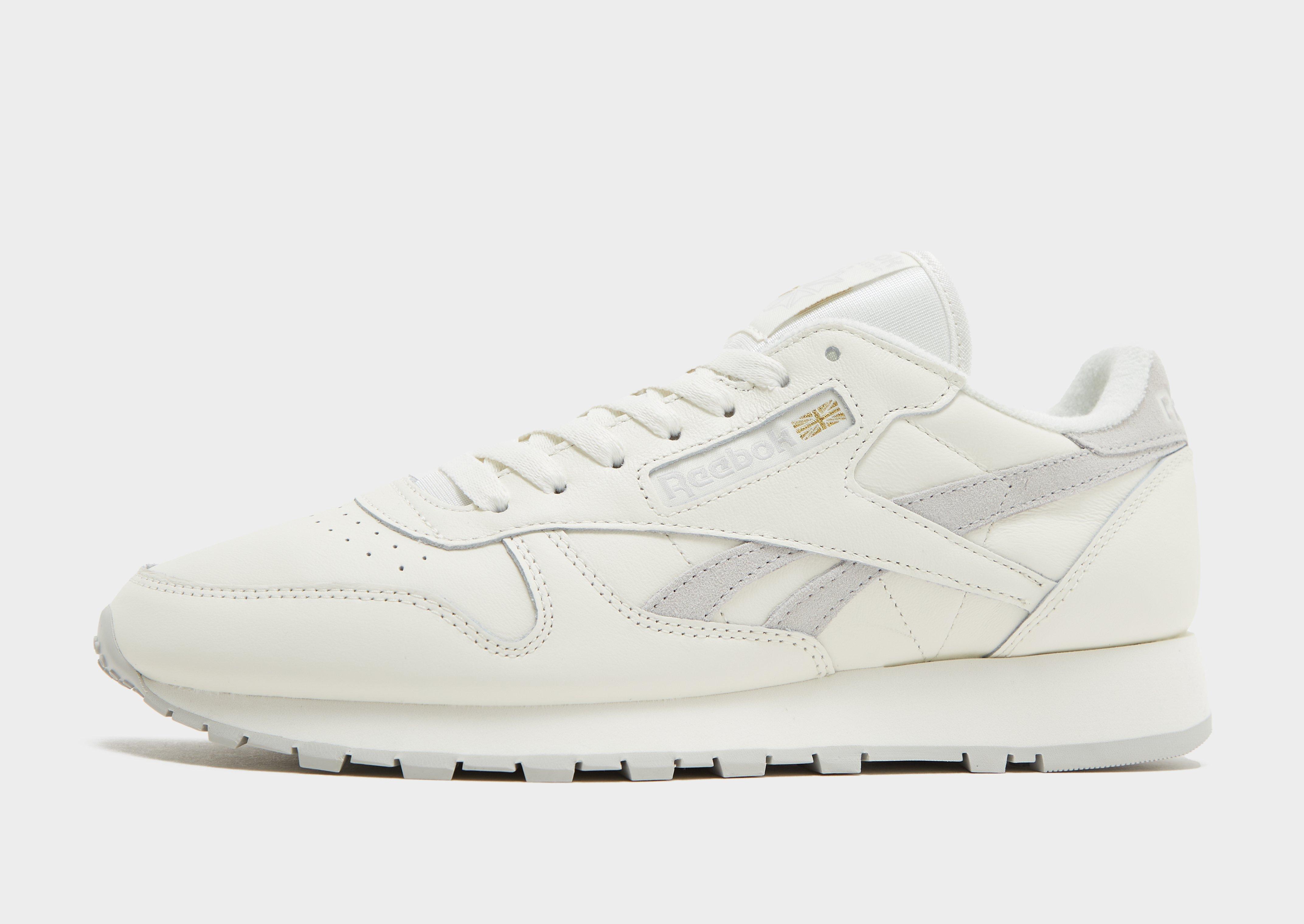 All white reebok store shoes