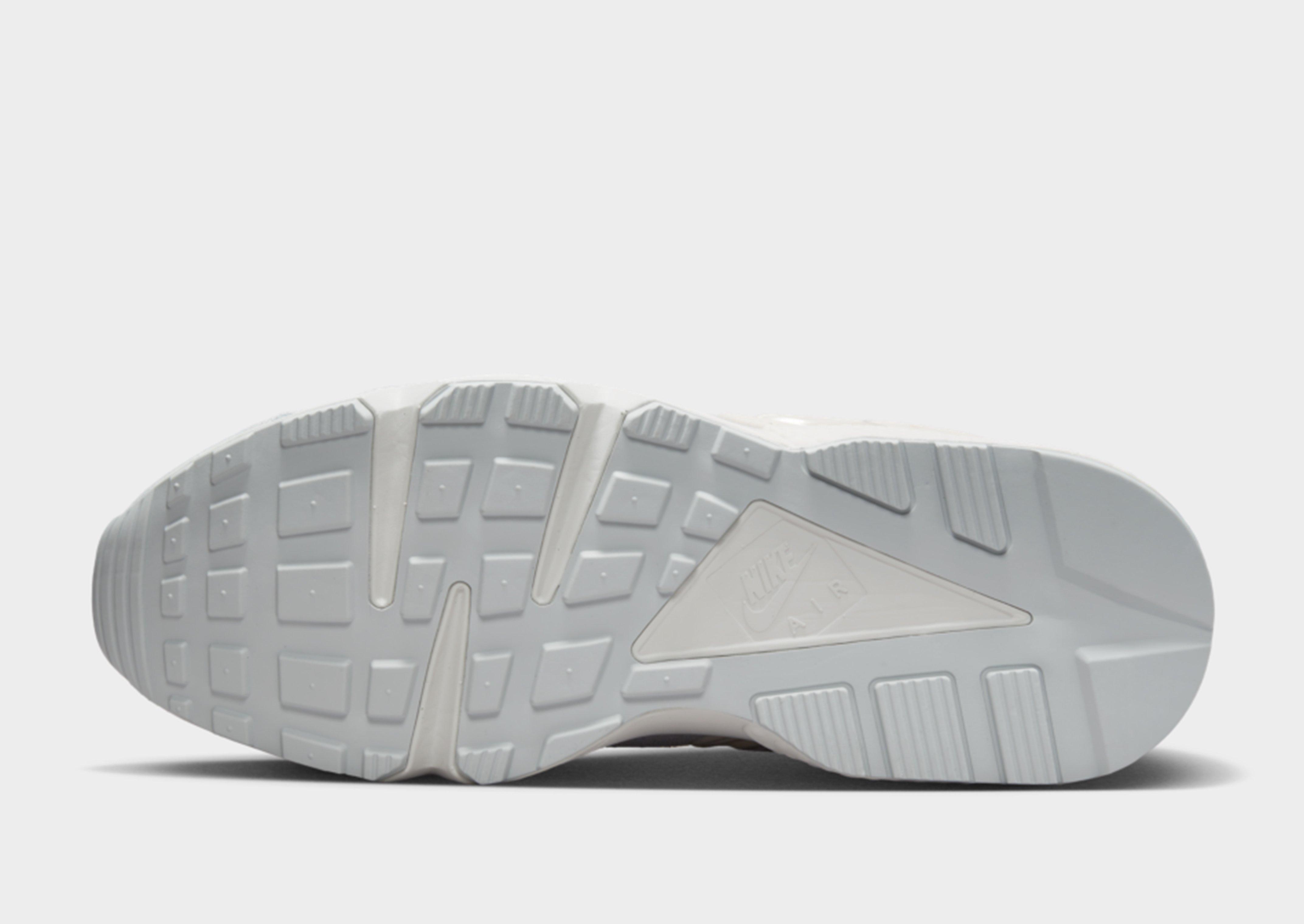 Nike Air Huarache Runner trainers in white and grey