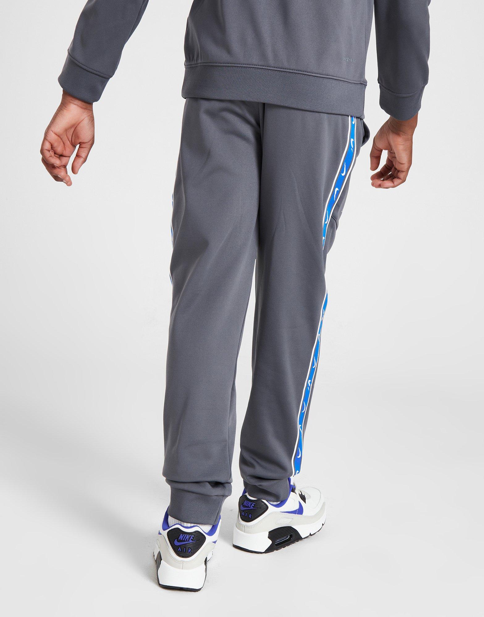 Nike taped poly sales track pants junior