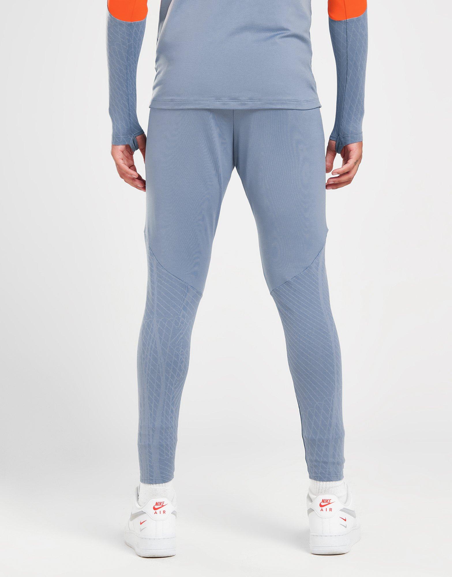 Nike polyknit track pants cheap in blue and orange