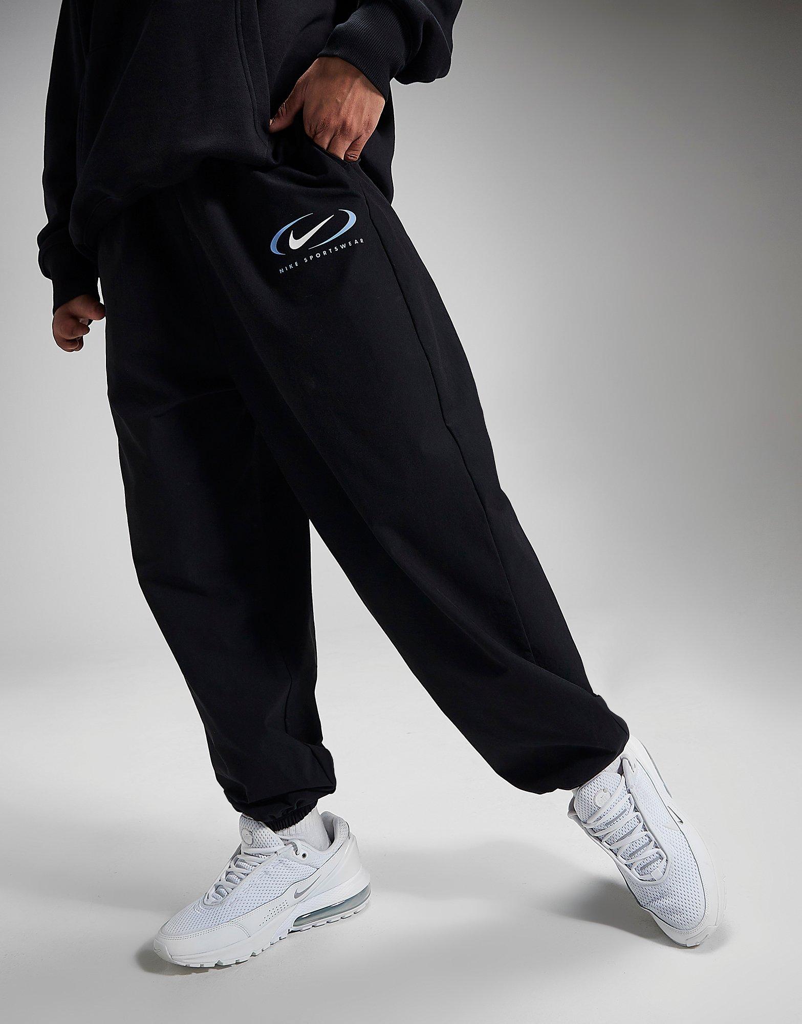 Nike Swoosh Woven joggers in Black