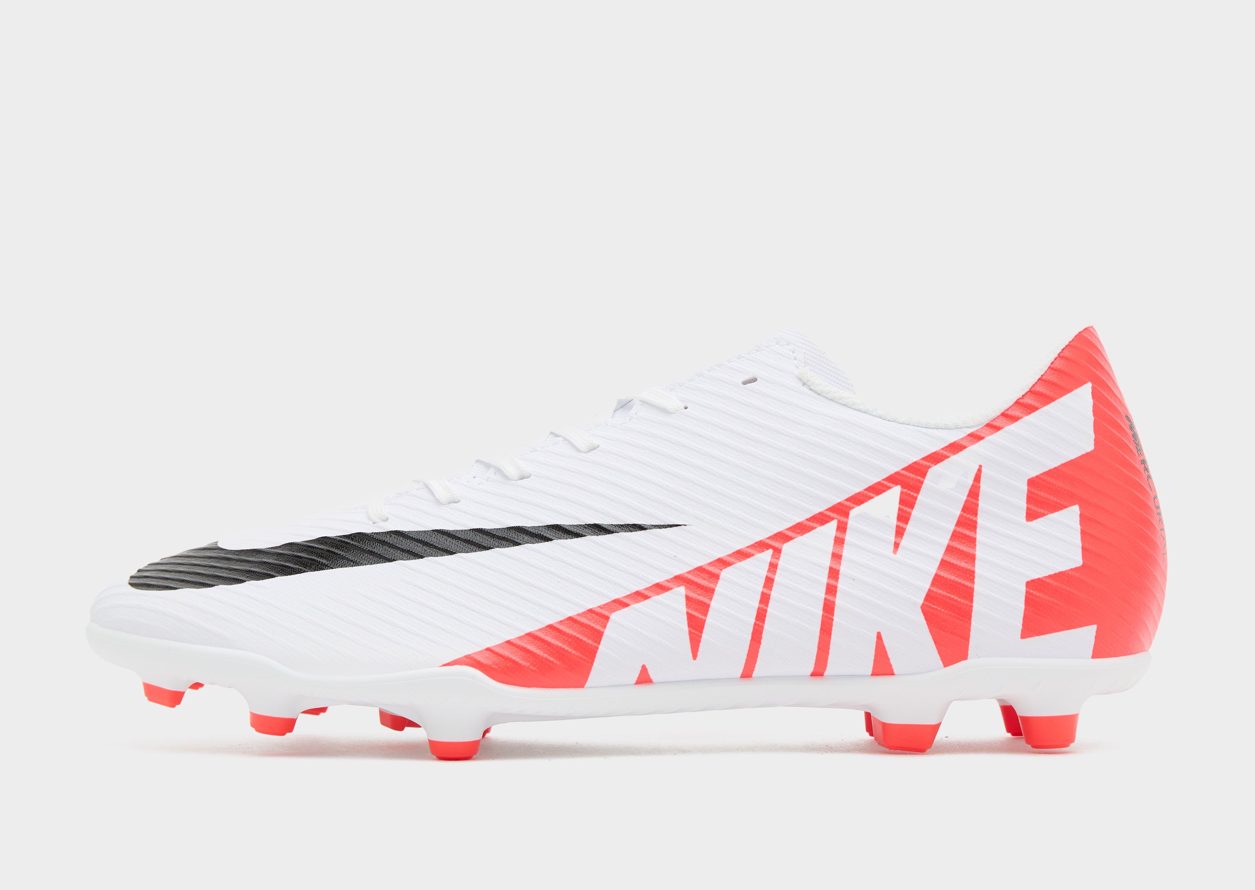 Pink and white store nike football boots