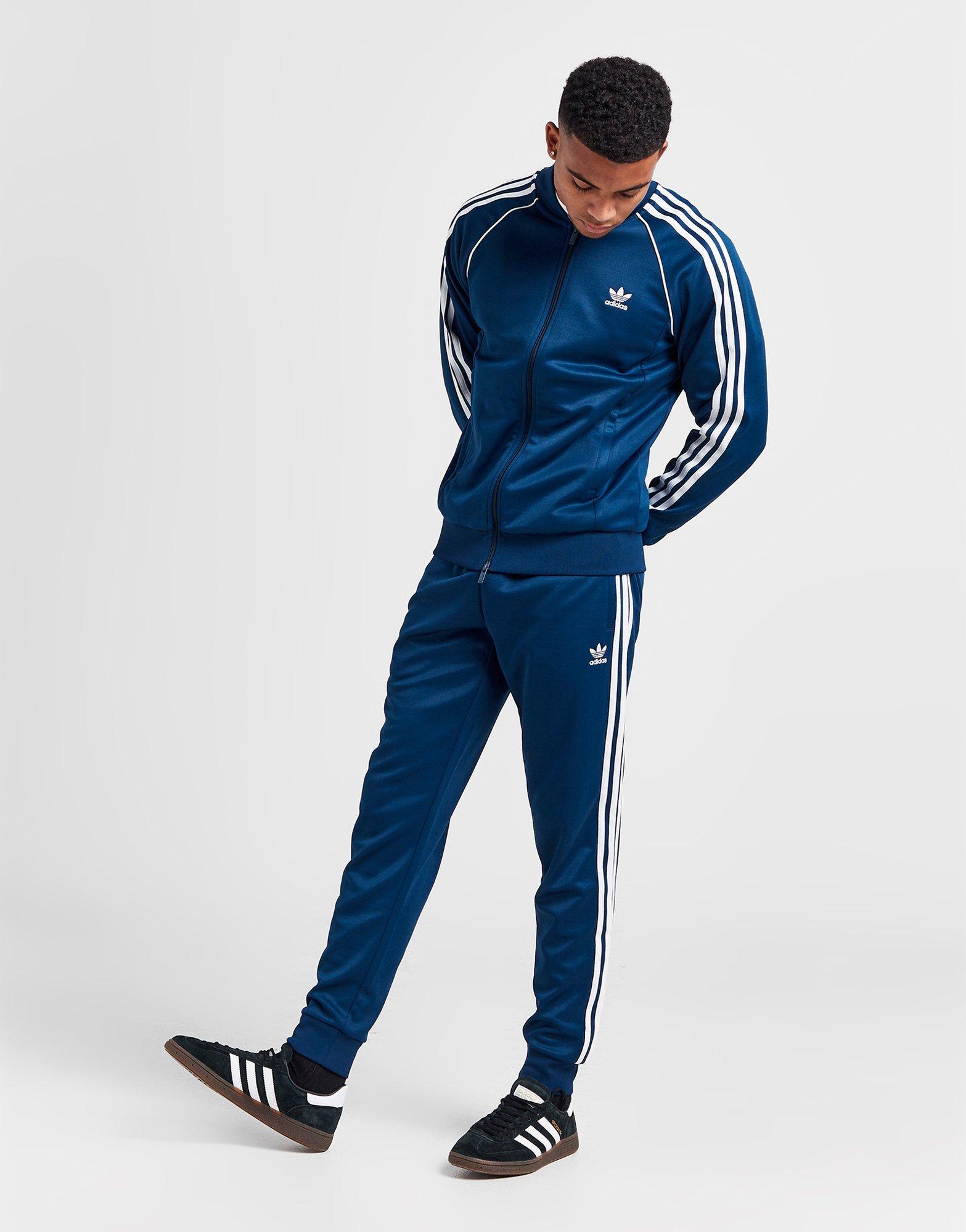 Pantaloni adidas cheap aperti ai lati