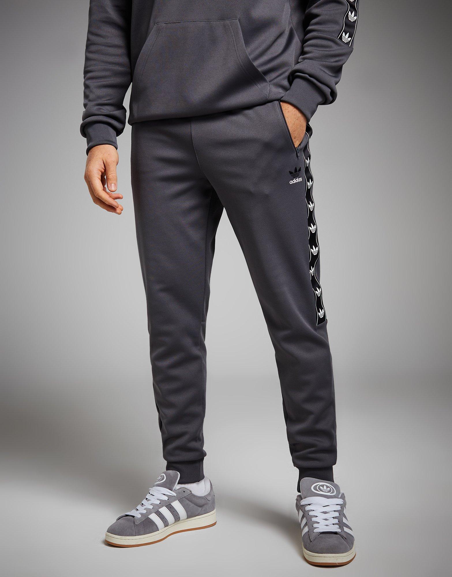 Jogging Homme Gris Adidas HL2297 - Taille et chevilles élastiquées - Bandes  le long des jambes