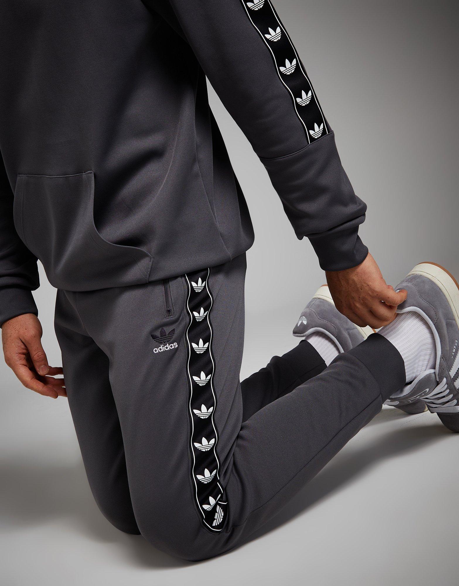 Adidas tape poly store track pants