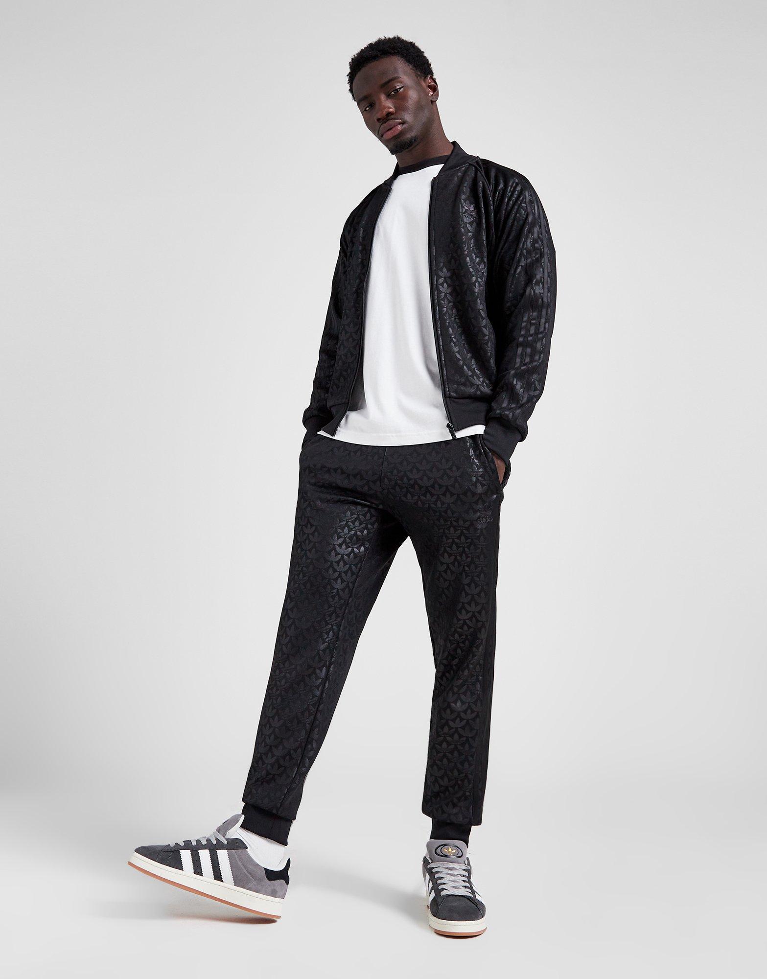 Adidas originals joggers with 2024 trefoil print in black