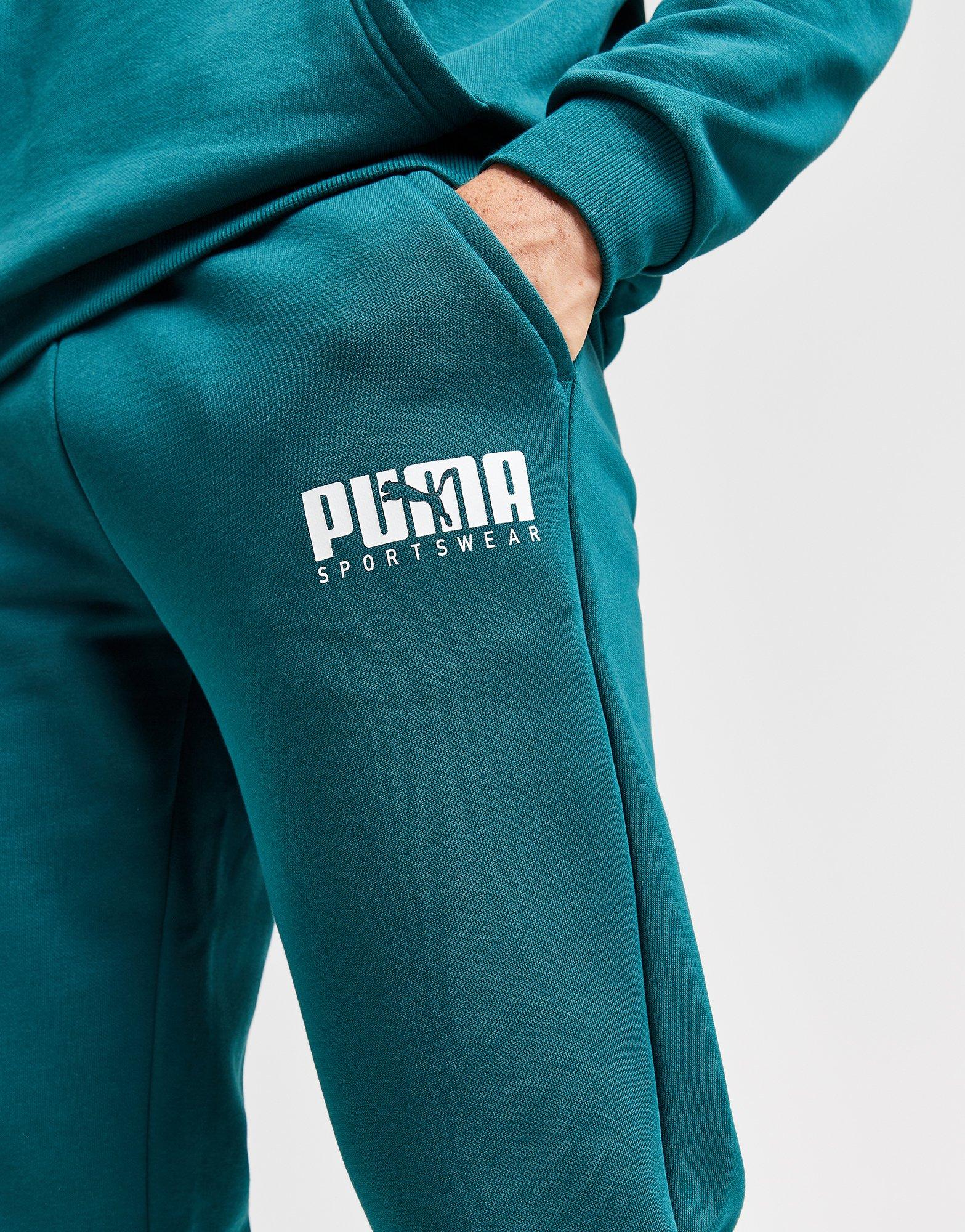 Puma Pantalones de chandal en Verde