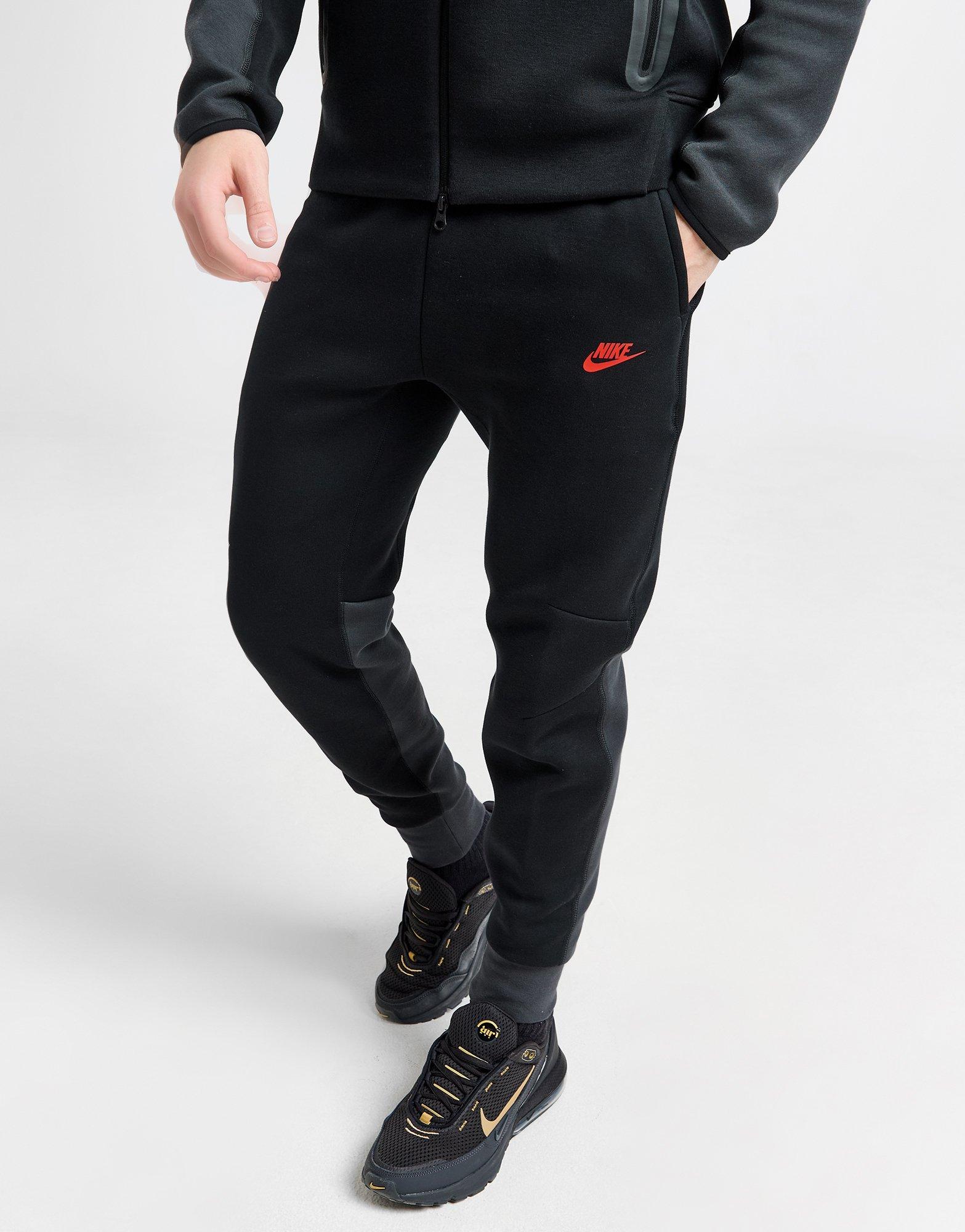 Nike joggers red sales tick