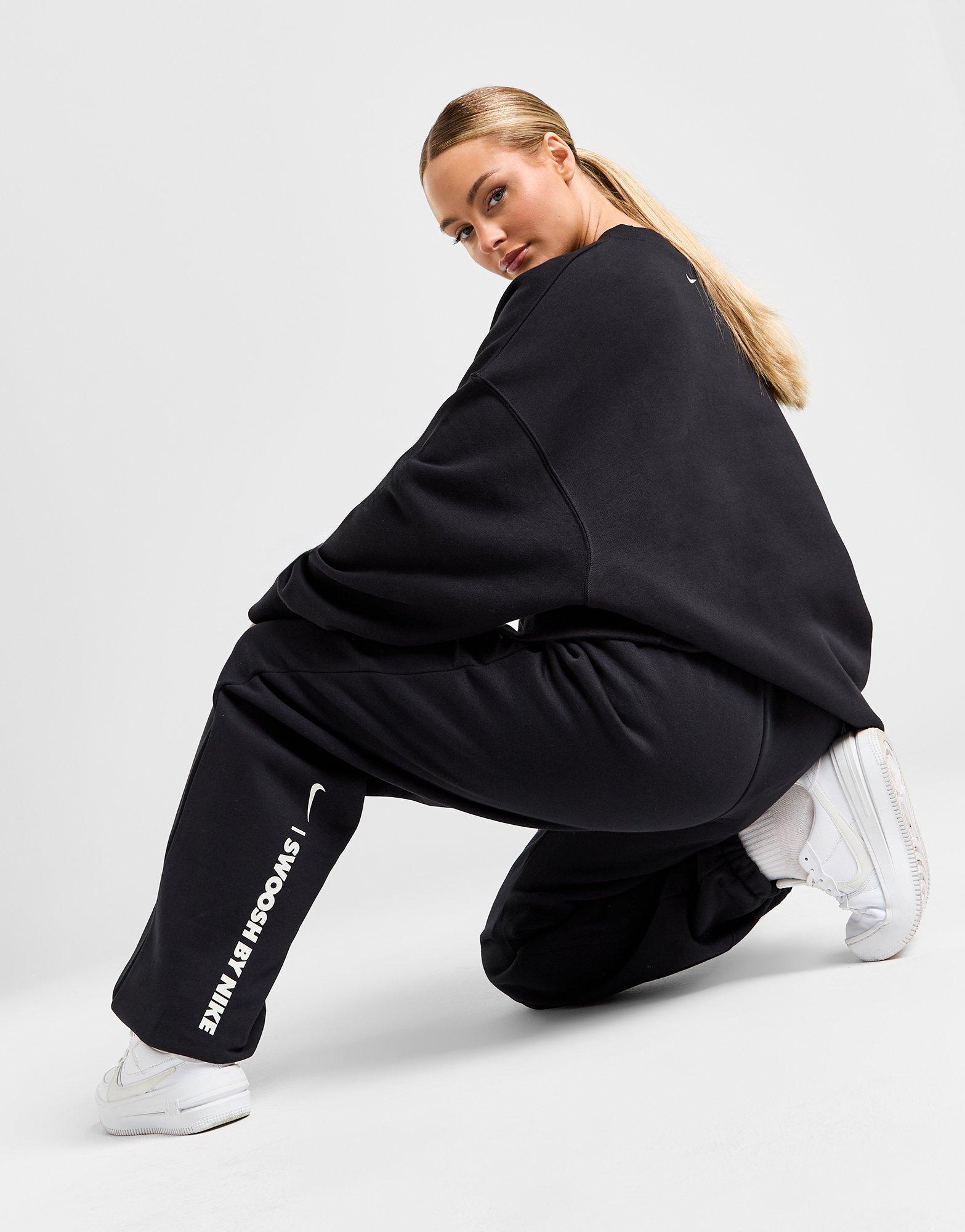 Nike swoosh oversized joggers best sale in black