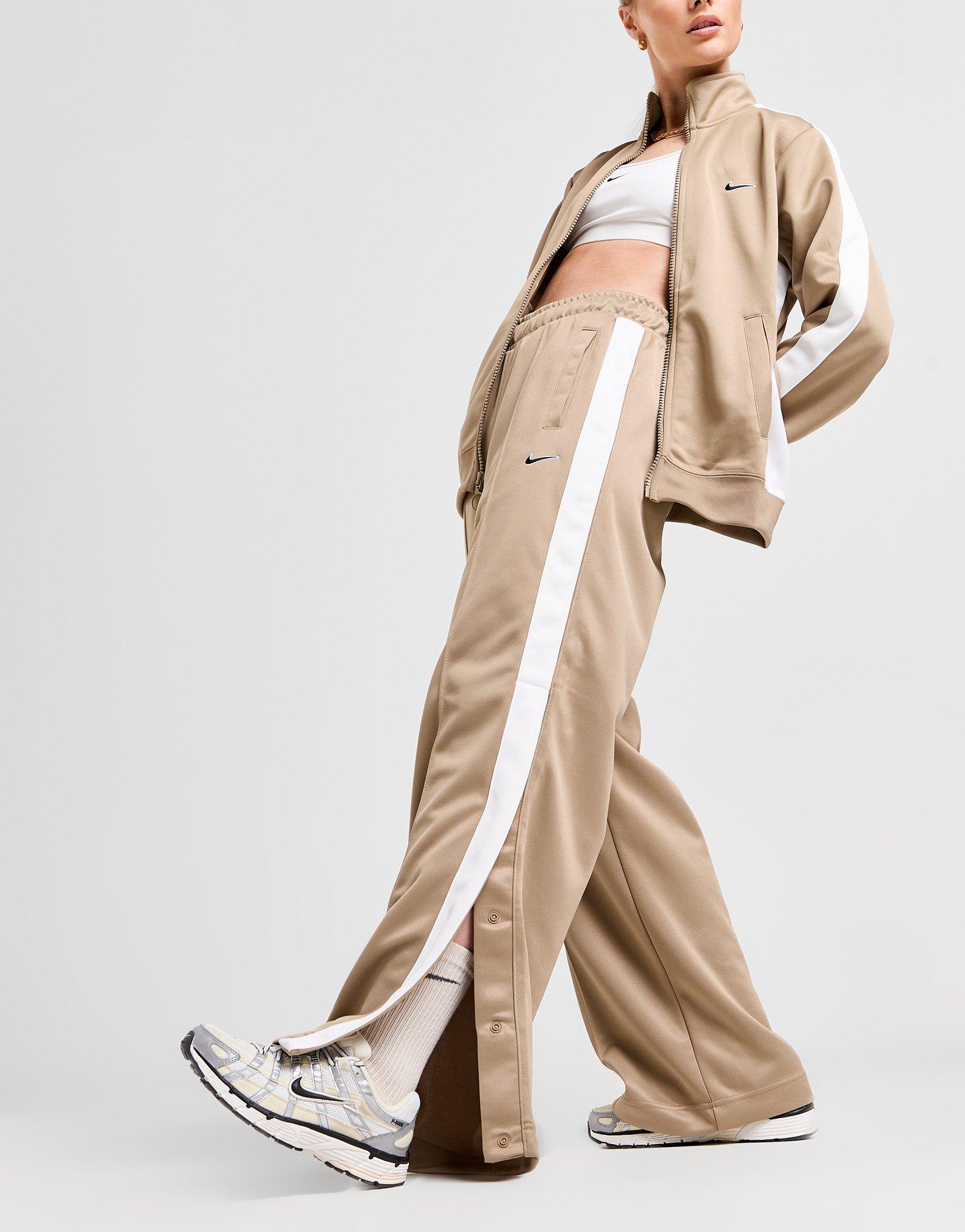 Nike beige best sale track pants