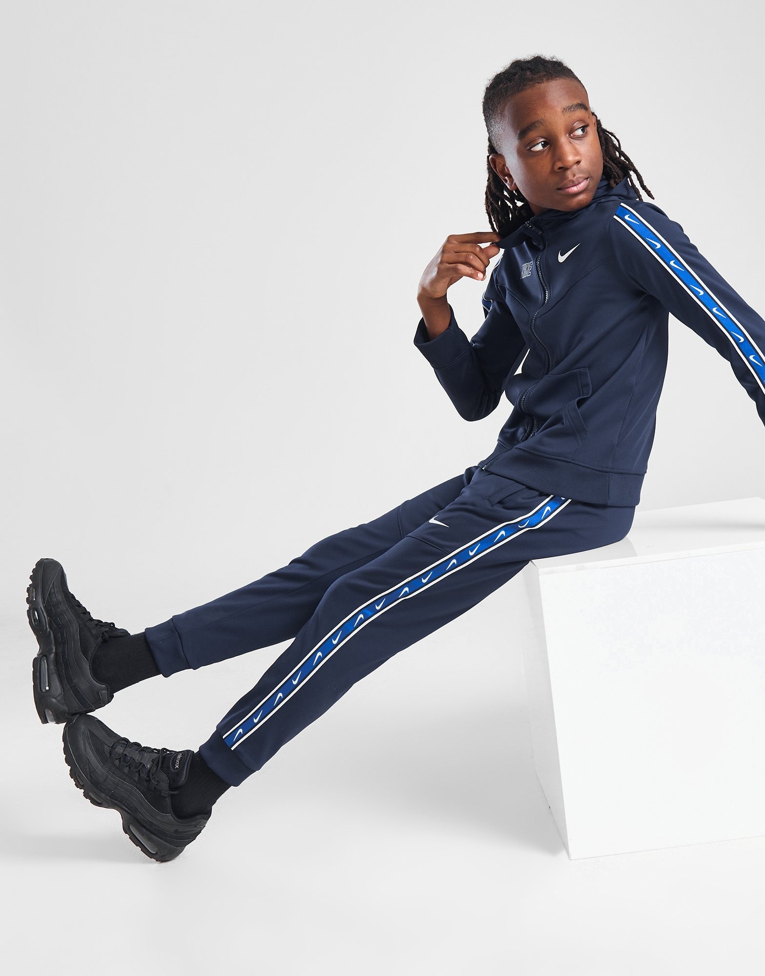 Nike taped poly track pants blue hotsell