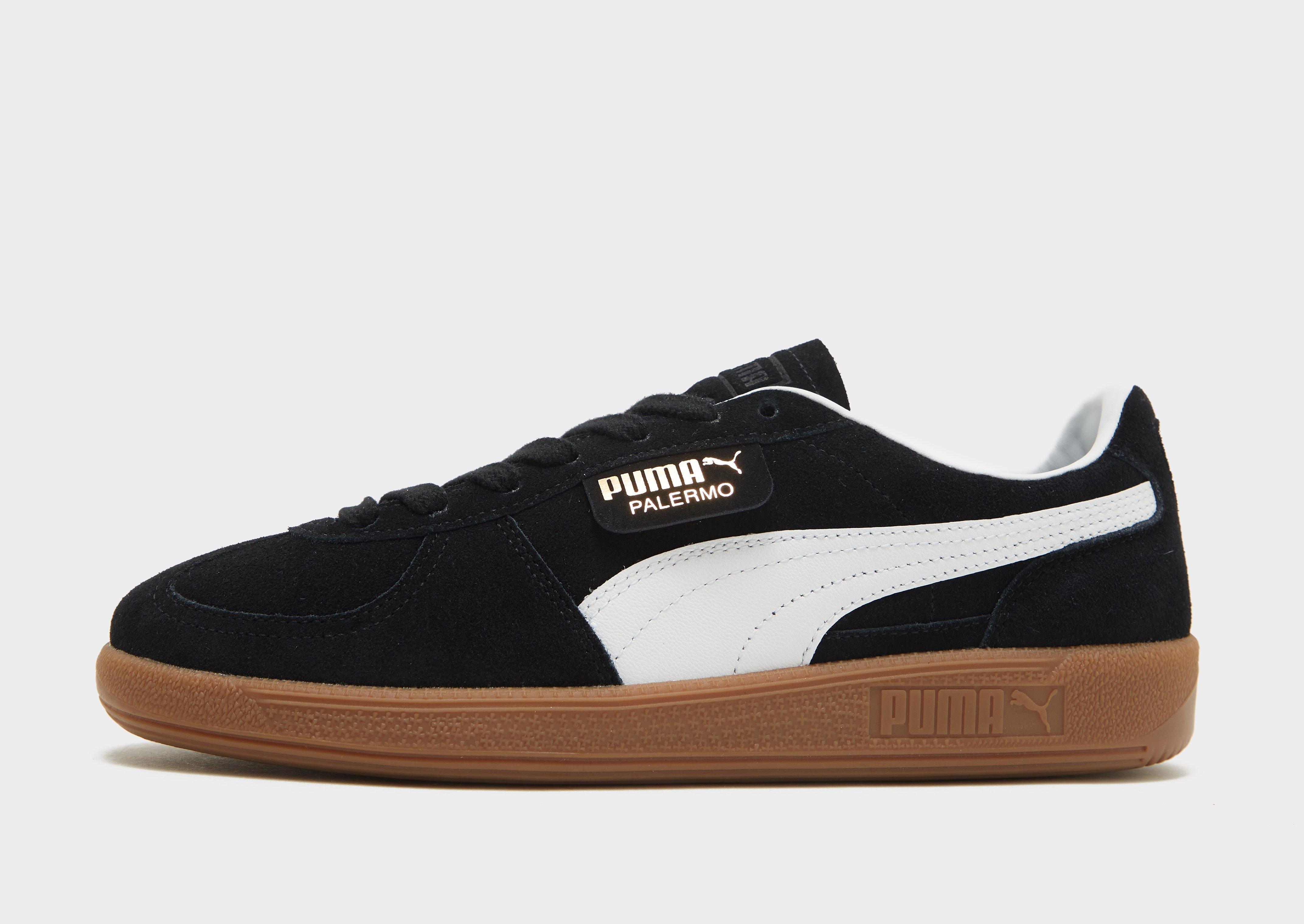 Puma suede black brown sole best sale