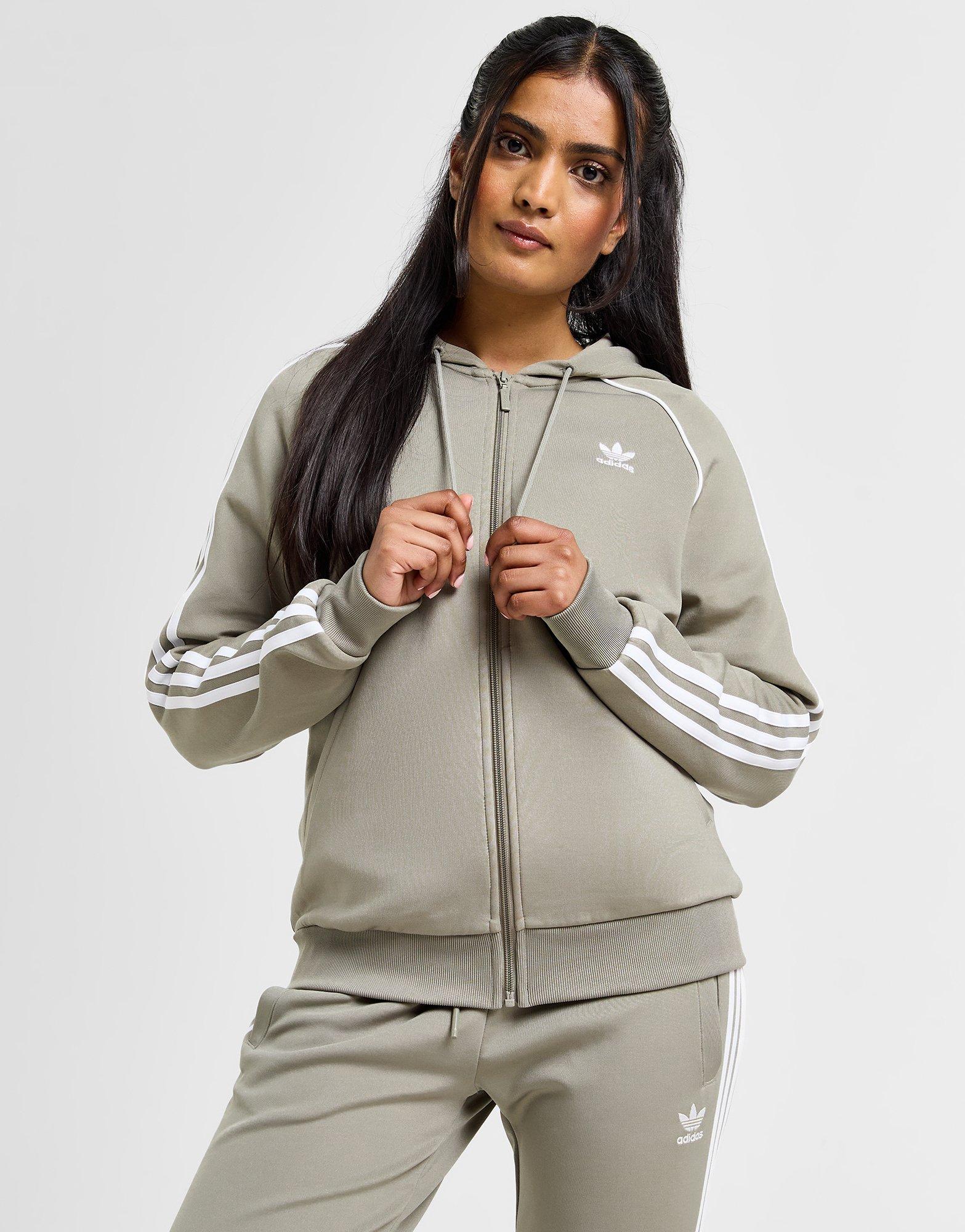 Black adidas hoodie with green stripes sales