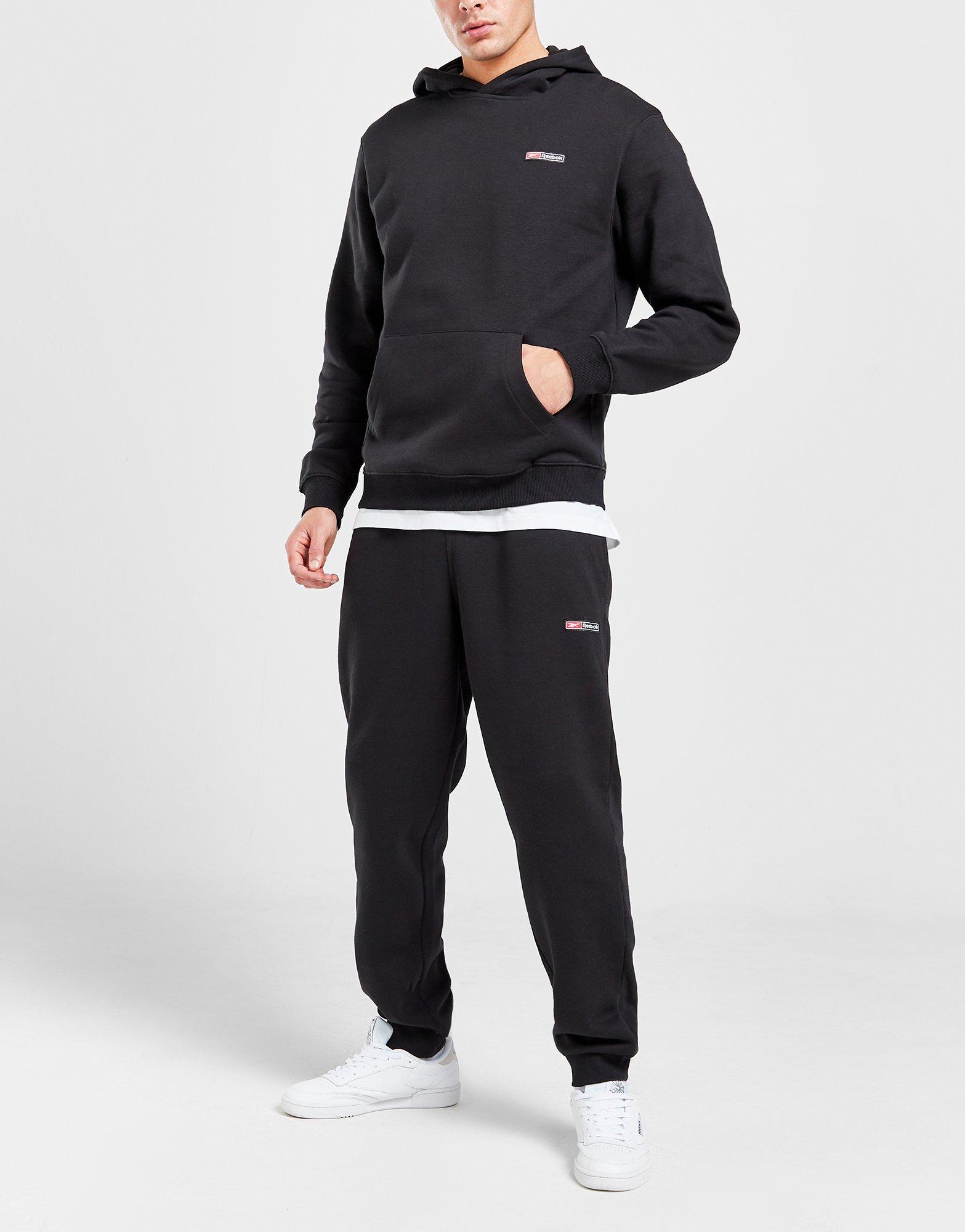 PANTALÓN DE CHANDAL REEBOK PARA HOMBRE CON PUÑO, NEGRO