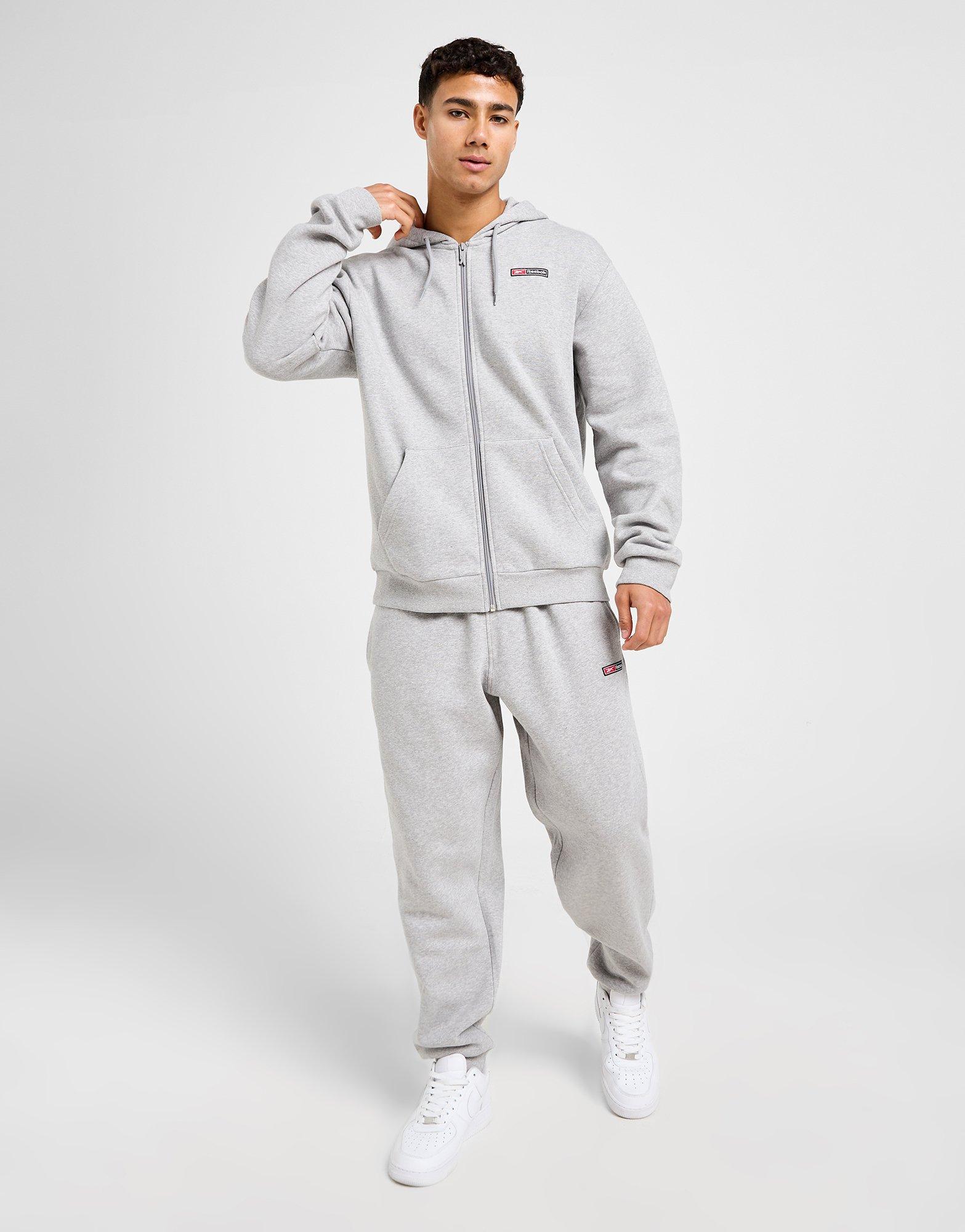 Reebok Sweat à Capuche Zippé Woven Homme