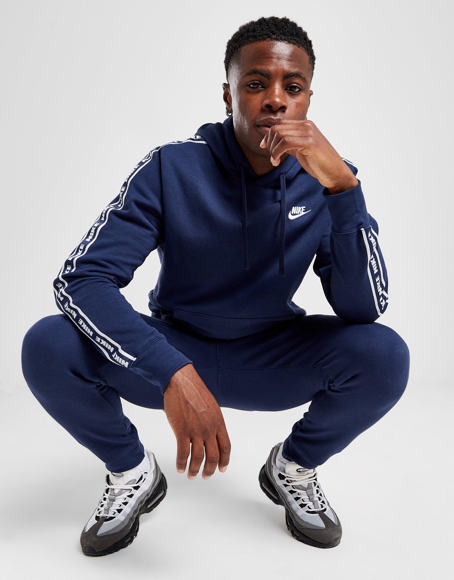 Navy and best sale white nike tracksuit