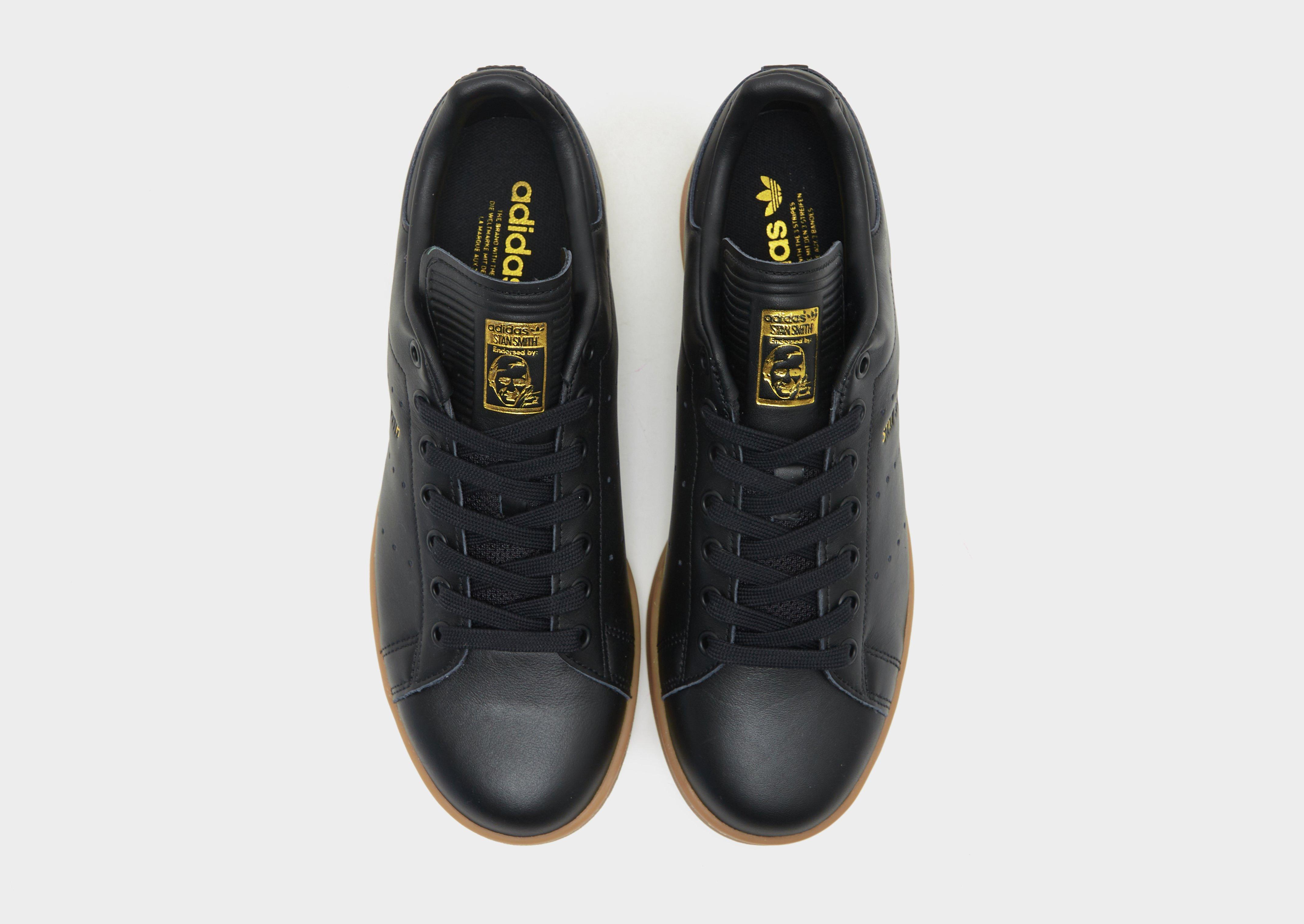 Adidas stan smith black gold on sale