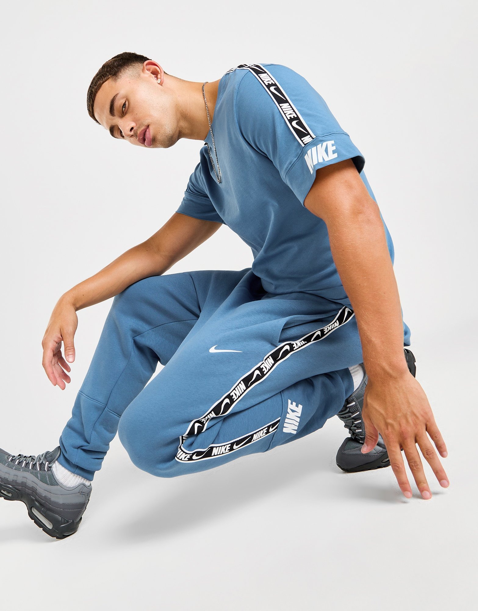 mens nike tape joggers