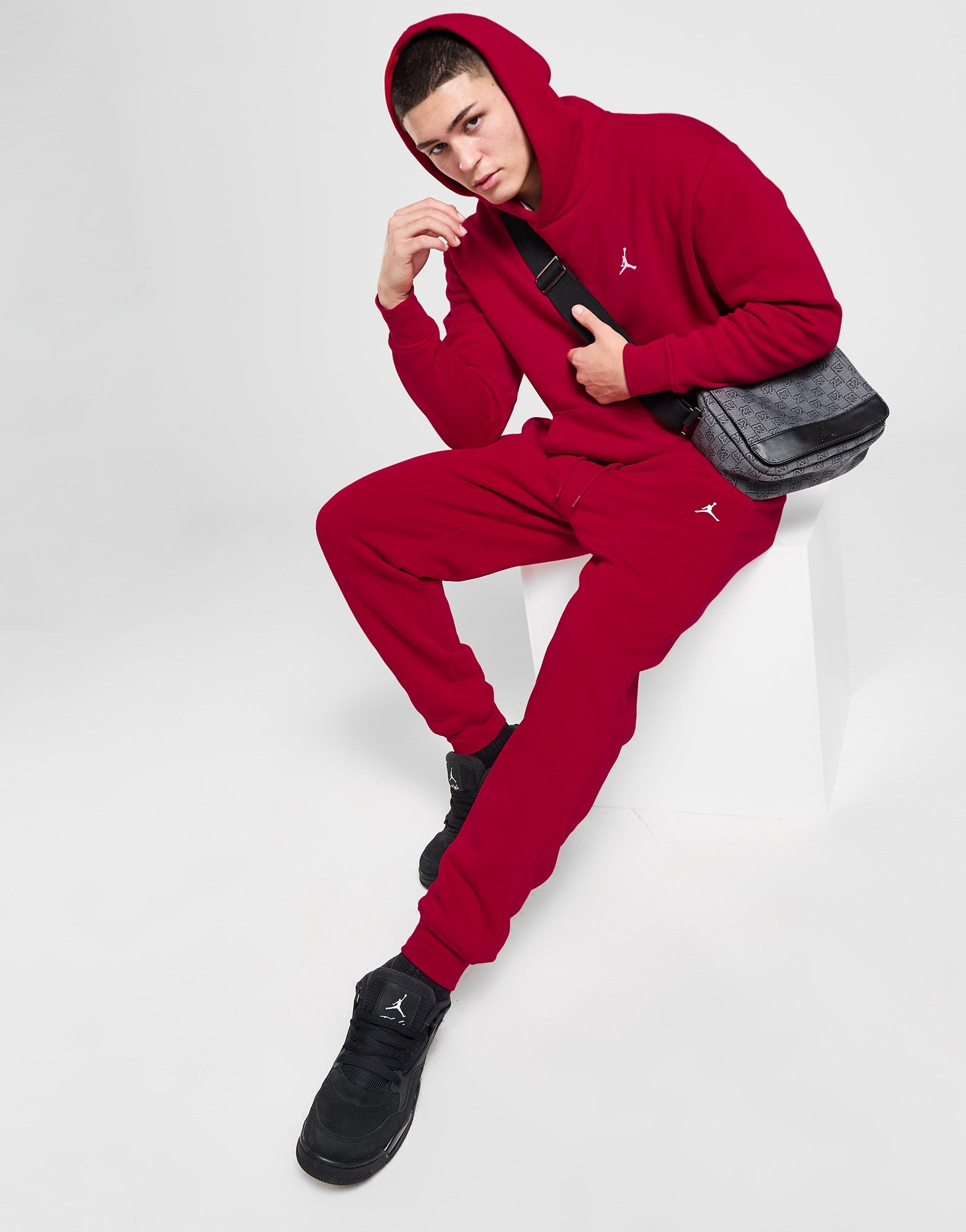 Red jordan sweats hotsell