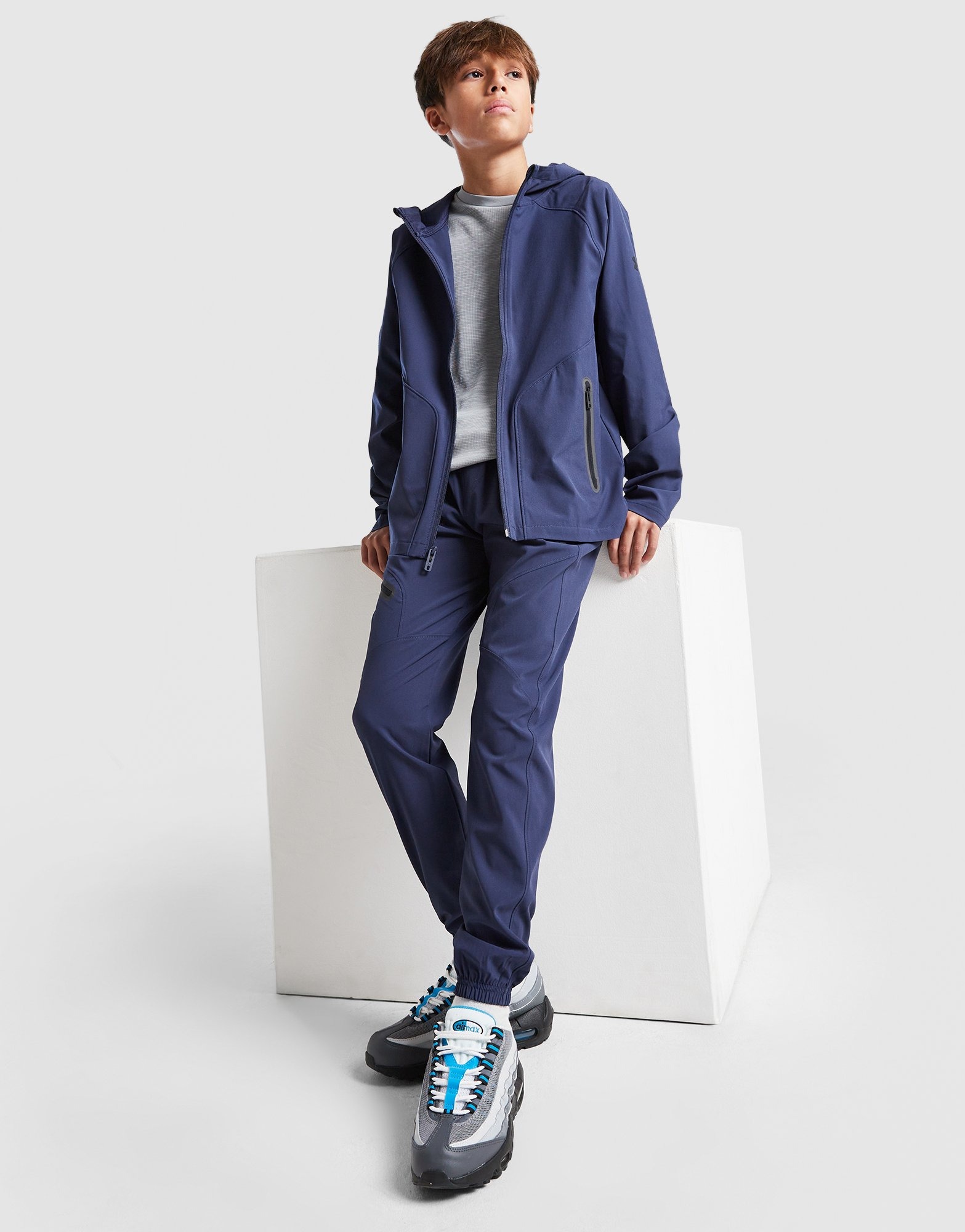 Blue Under Armour Unstoppable Woven Track Pants Junior | JD Sports UK