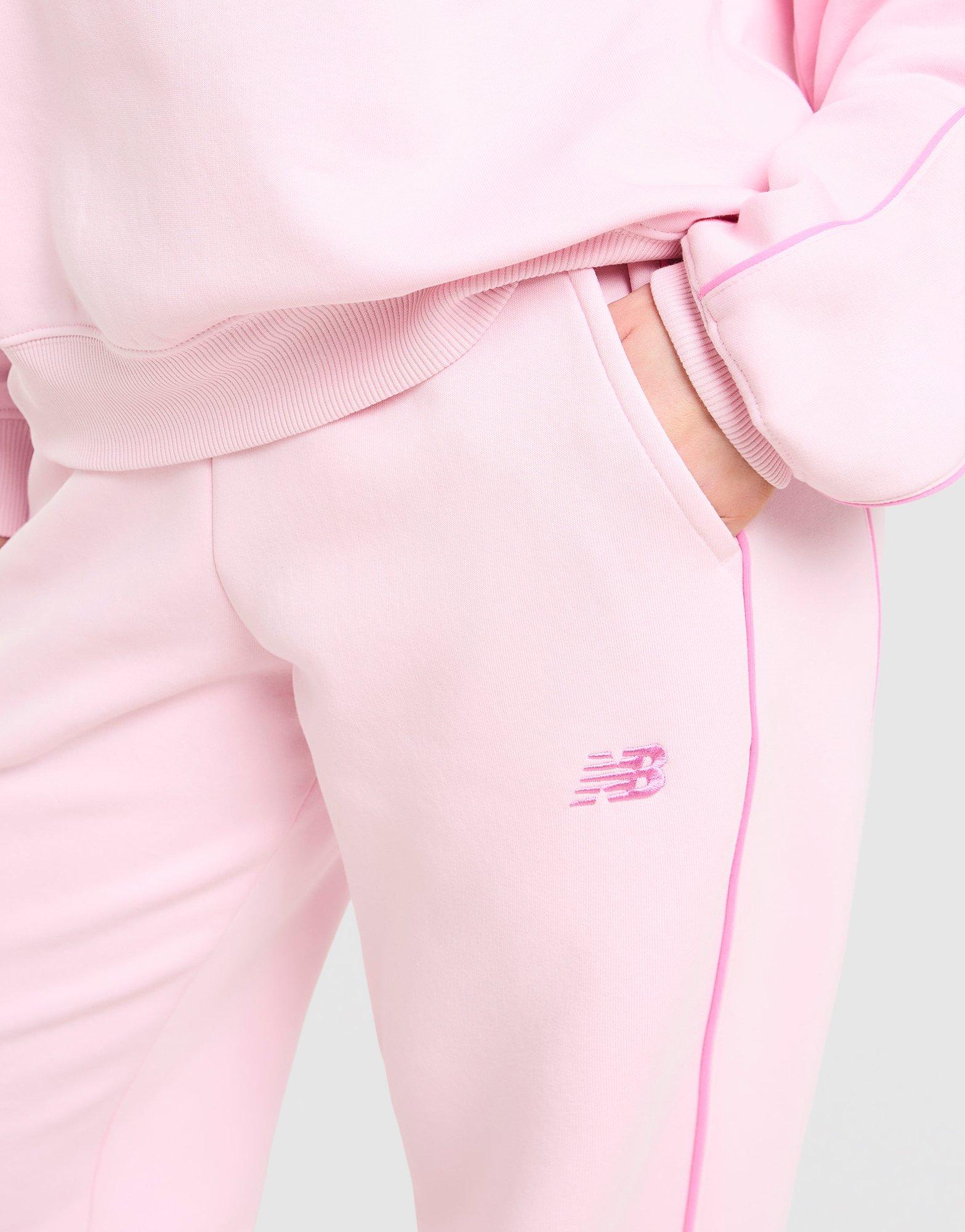 New Balance Leveät collegehousut Naiset