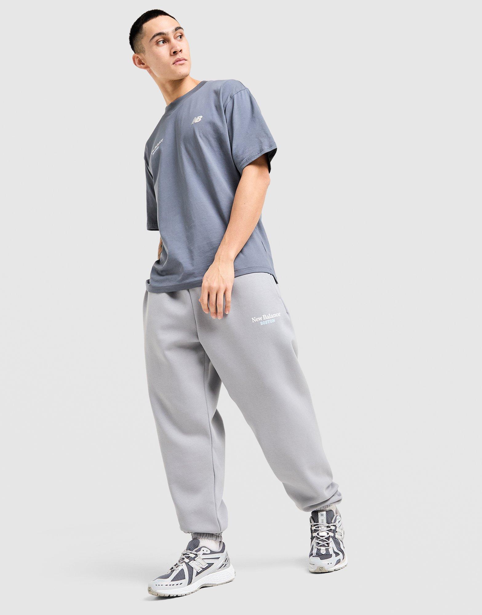 New Balance Pantaloni della tuta Run Club