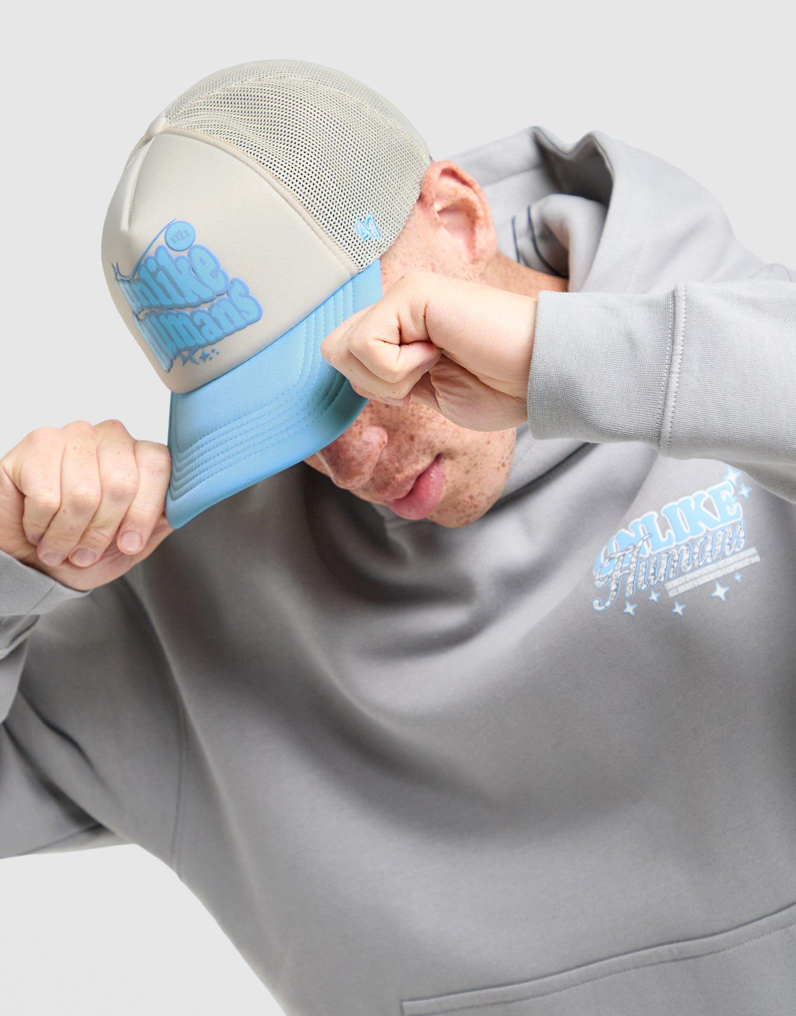 Unlike Humans Made Trucker Cap
