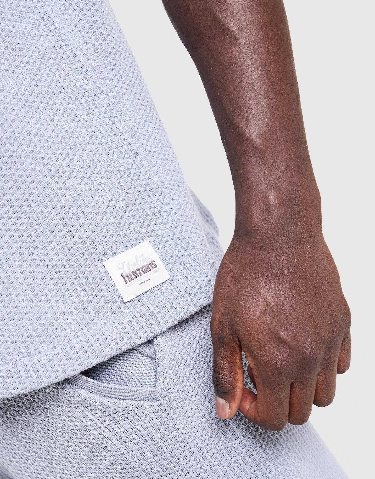 Unlike Humans Commerce Polo Shirt