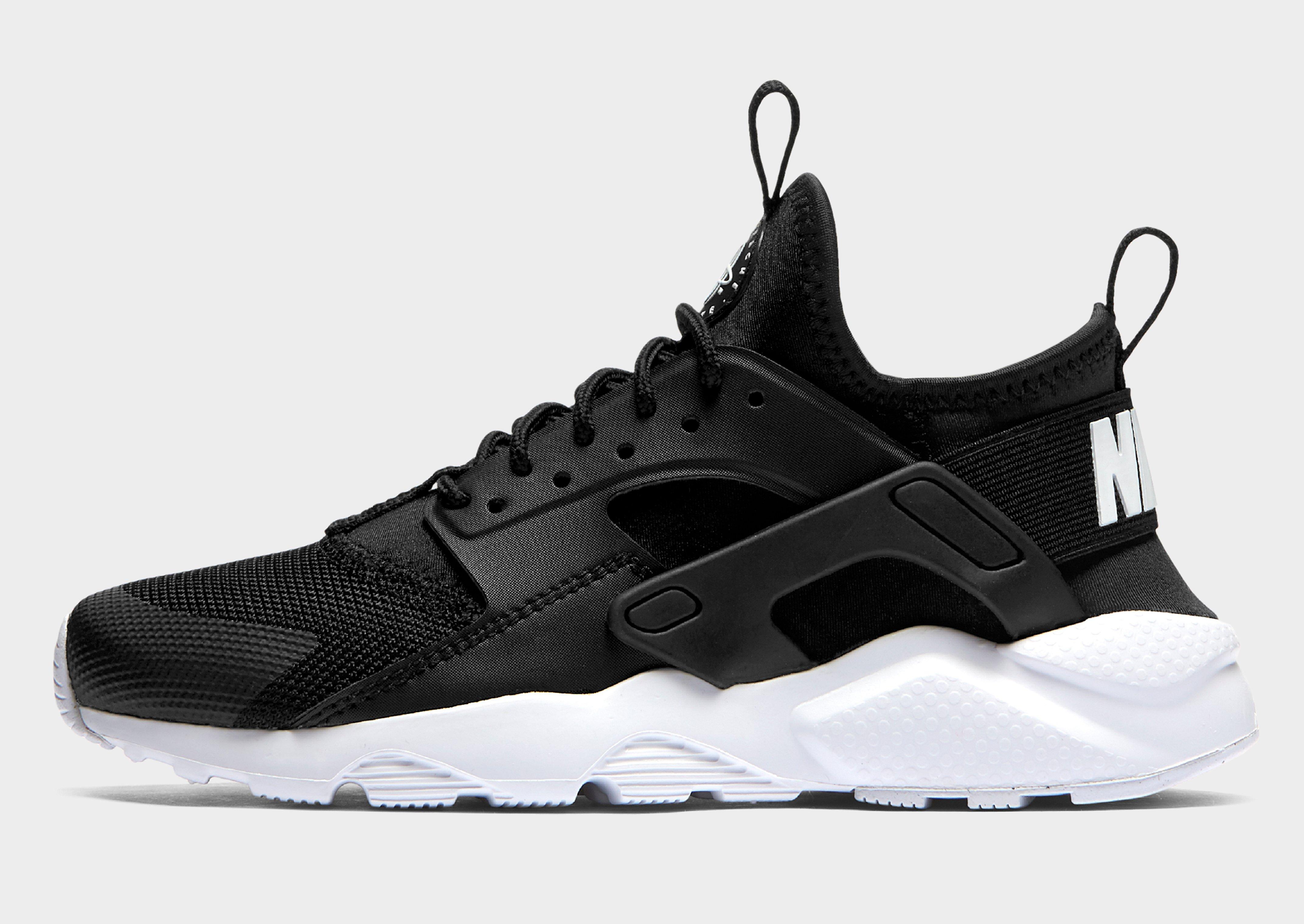 black and white huaraches junior