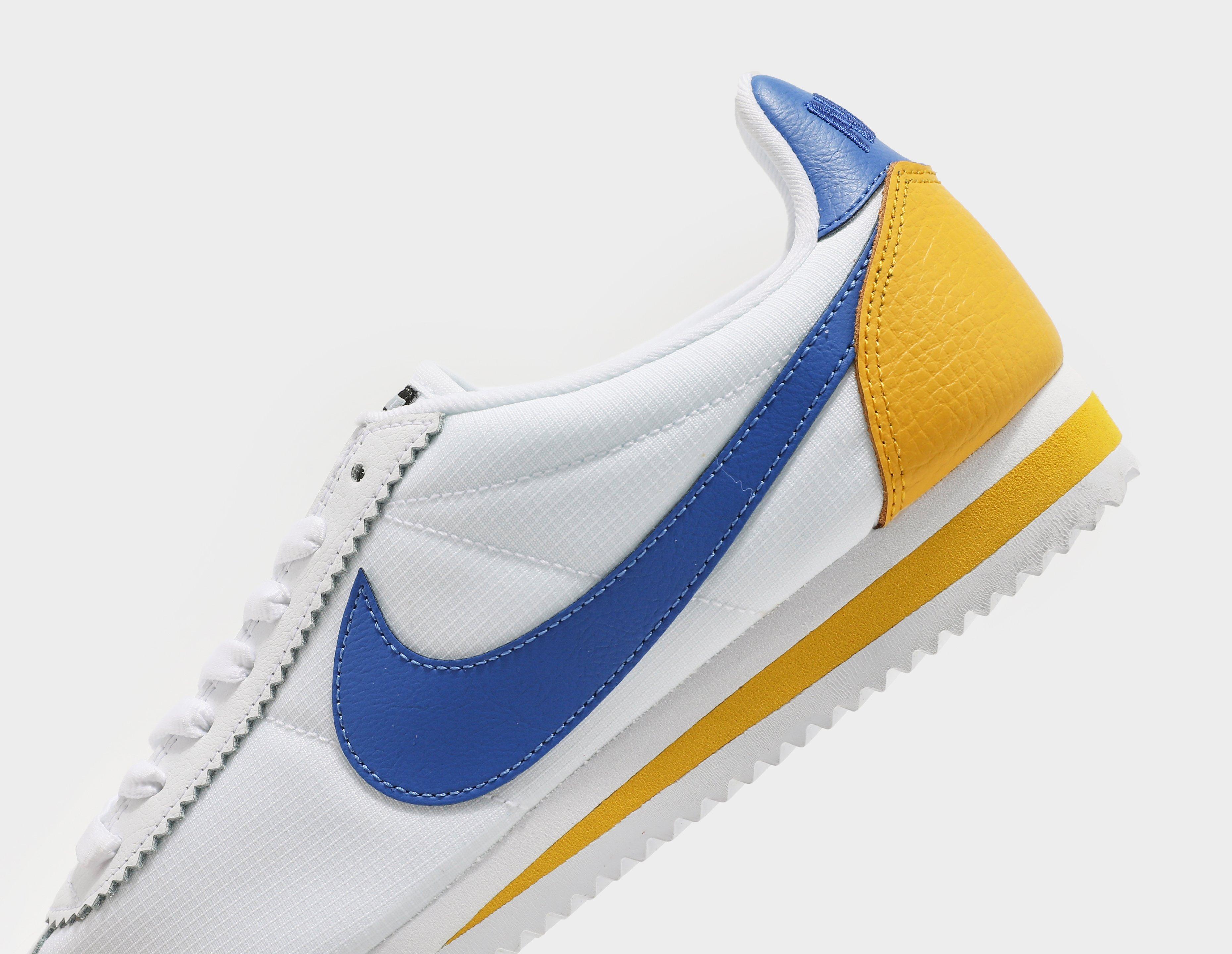 nike cortez yellow and blue