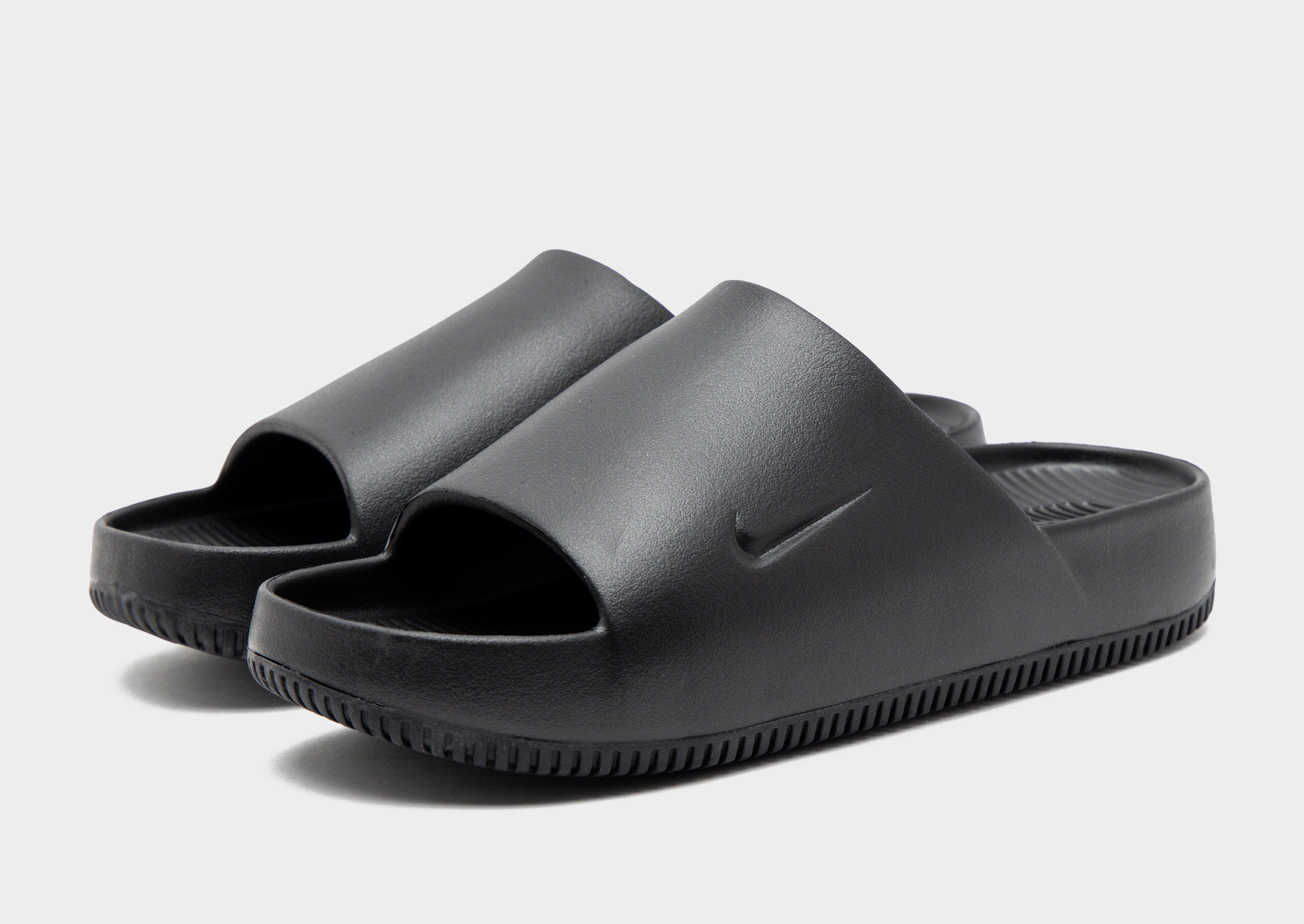 Black on best sale black nike slides