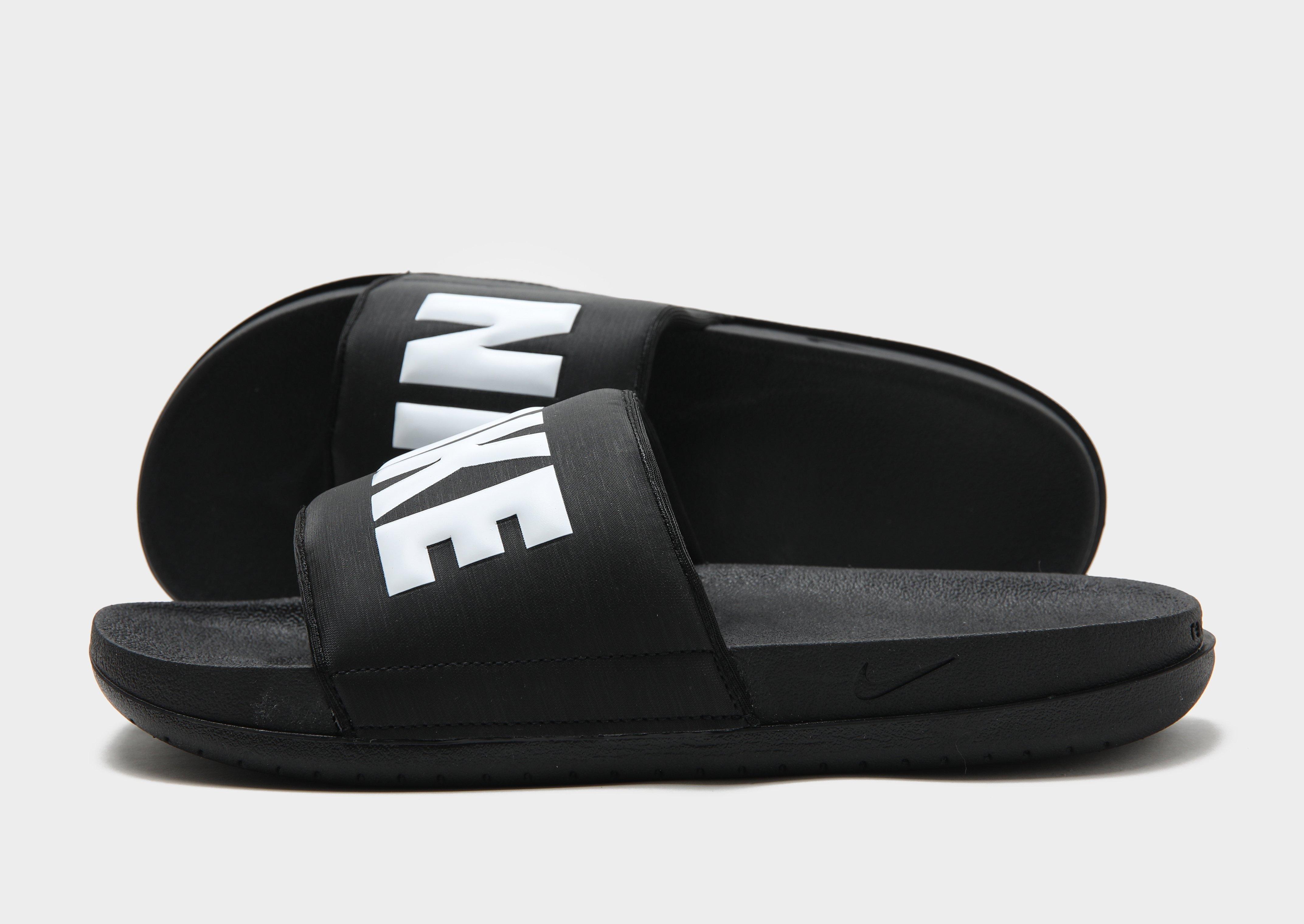 nike offcourt sliders in black with fur