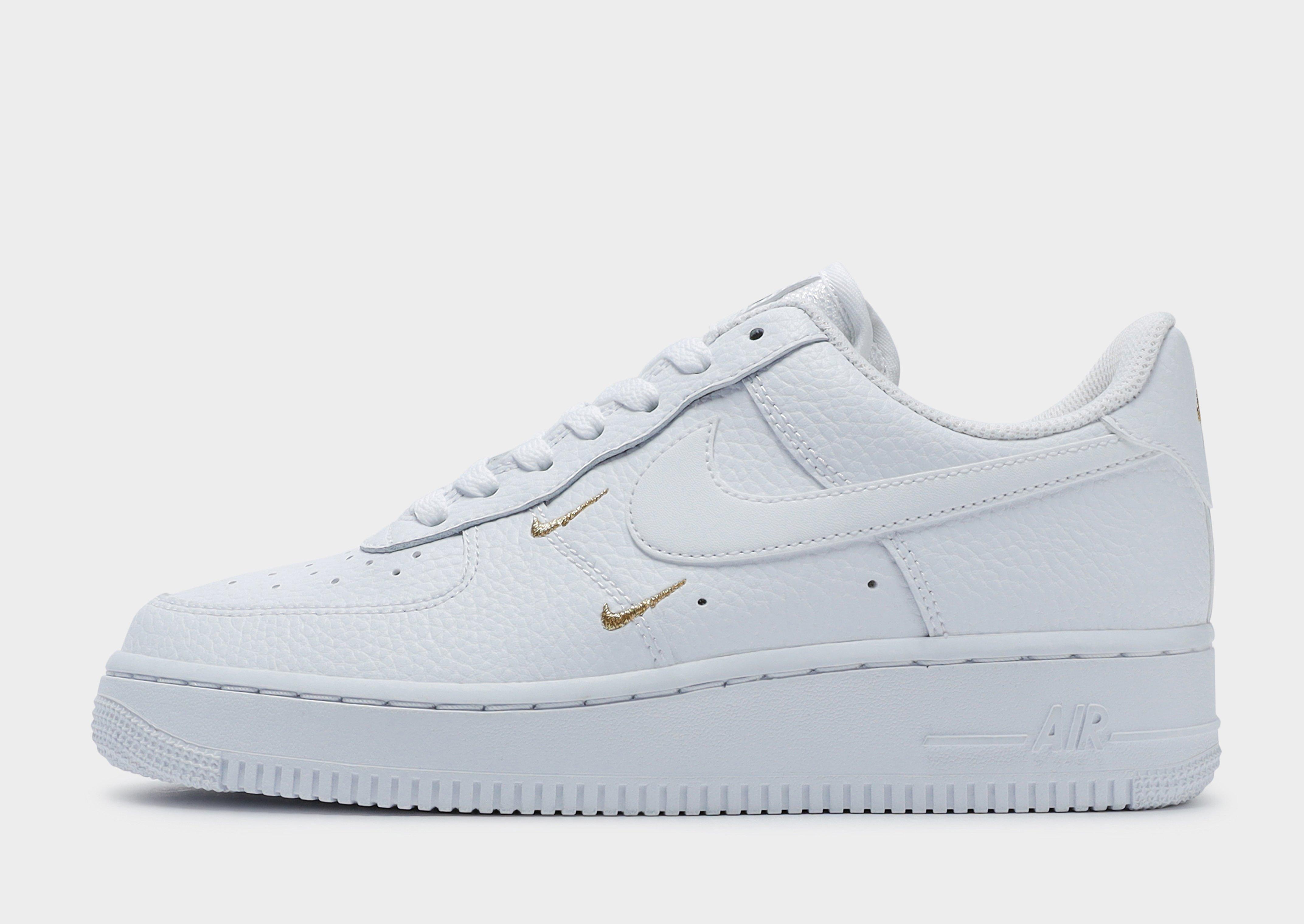nike air force 1 with gold swoosh