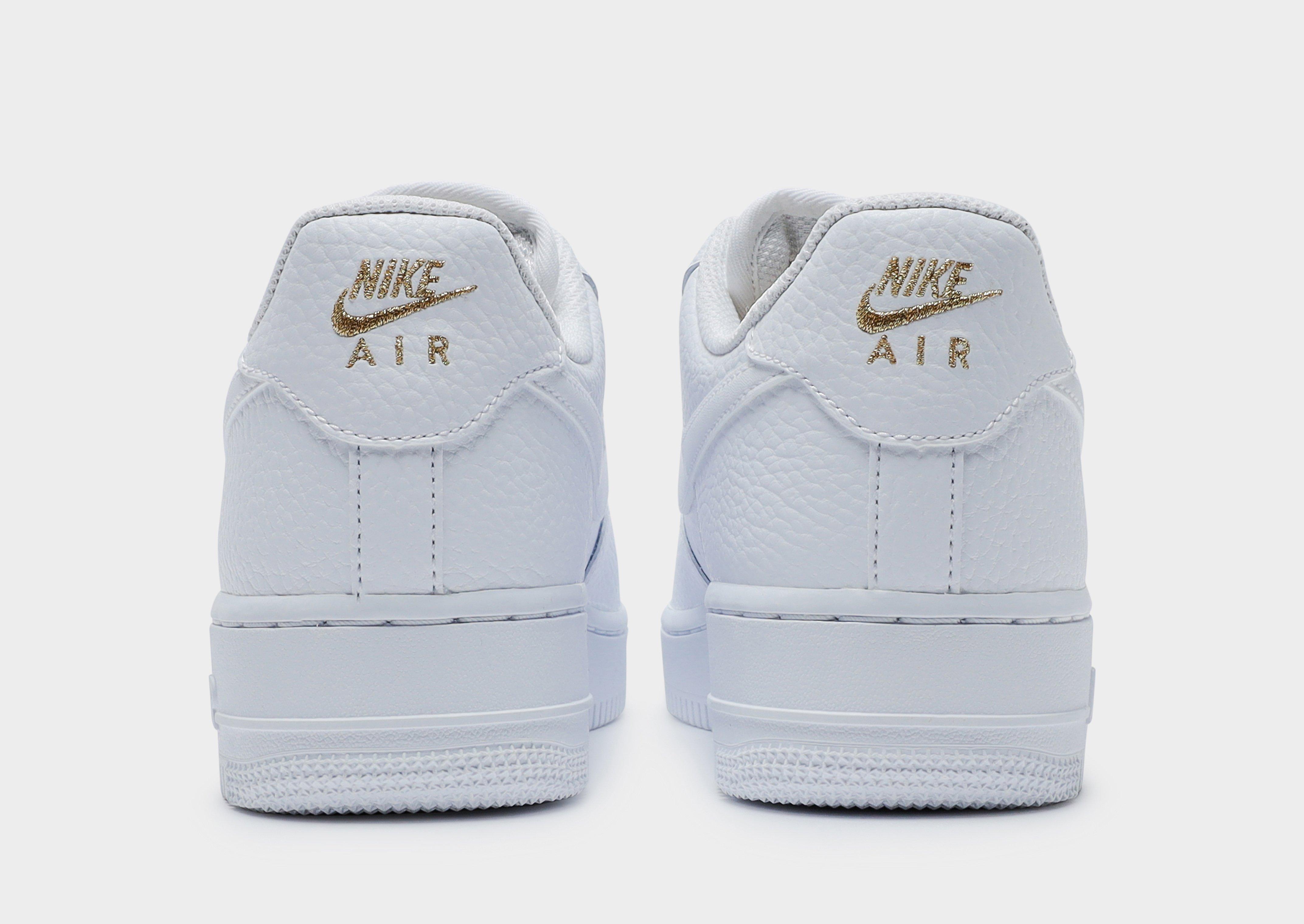 nike air force one gold swoosh