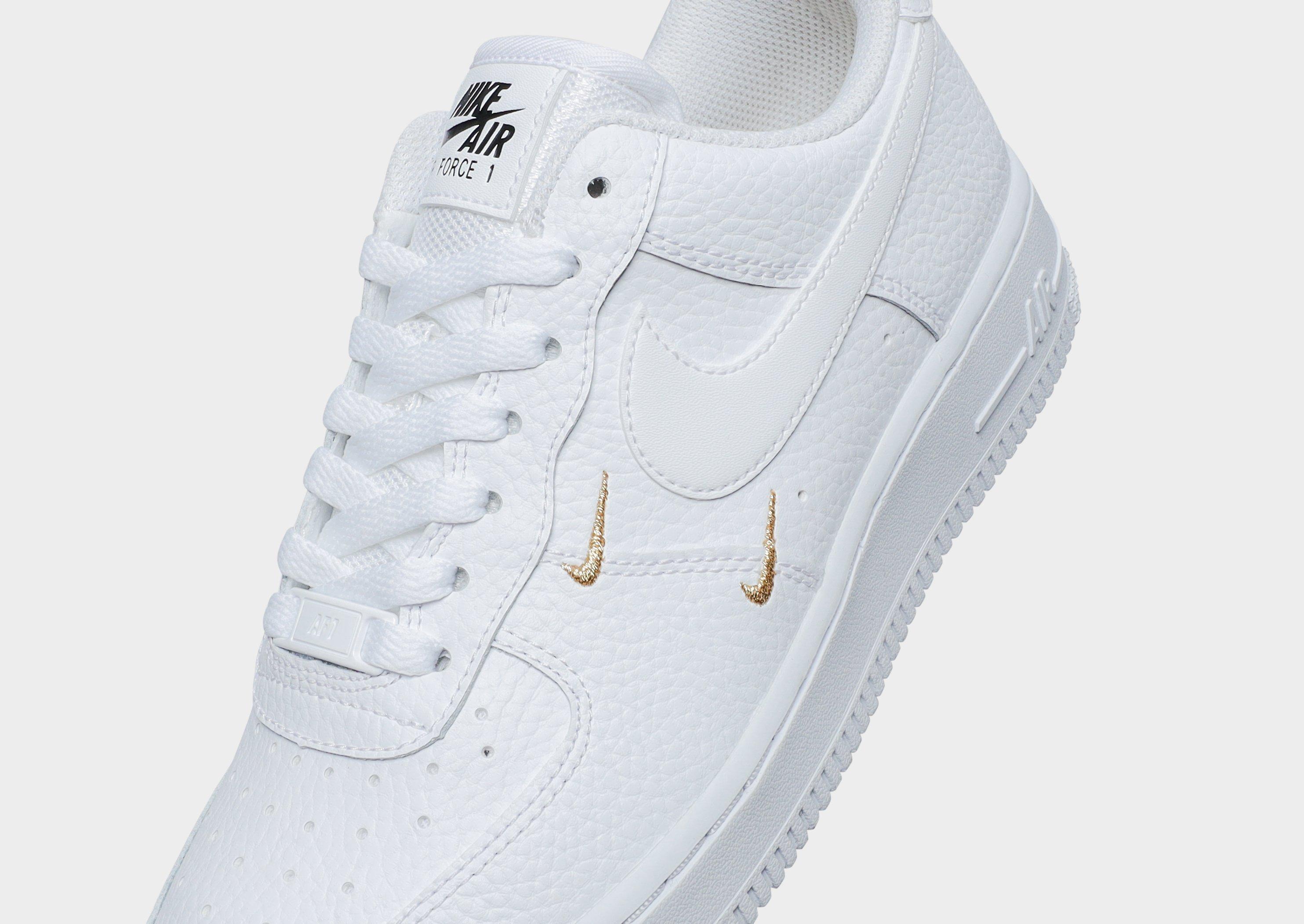 womens white nike shoes with gold swoosh