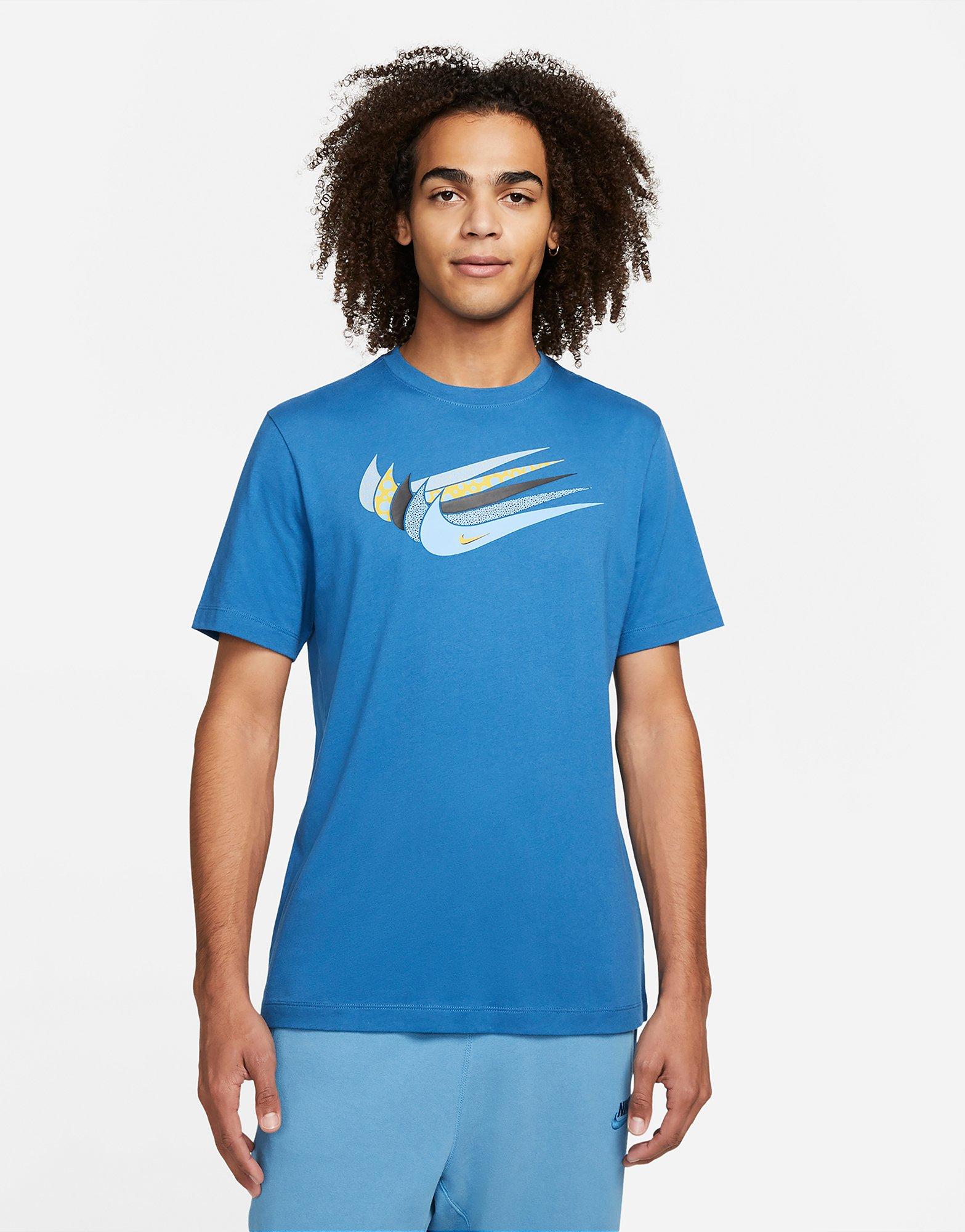 white nike shirt with blue swoosh