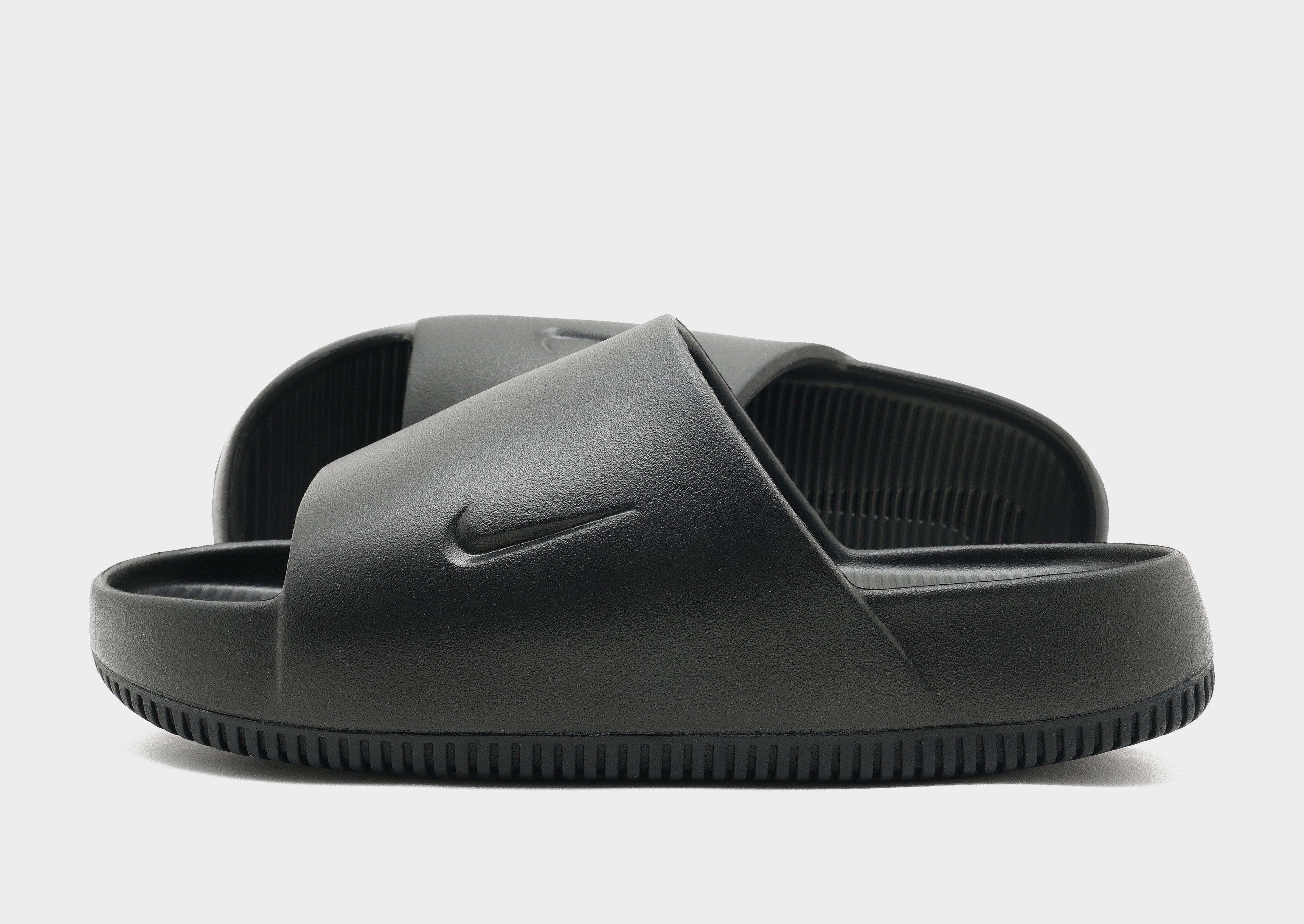 All black nike online slide