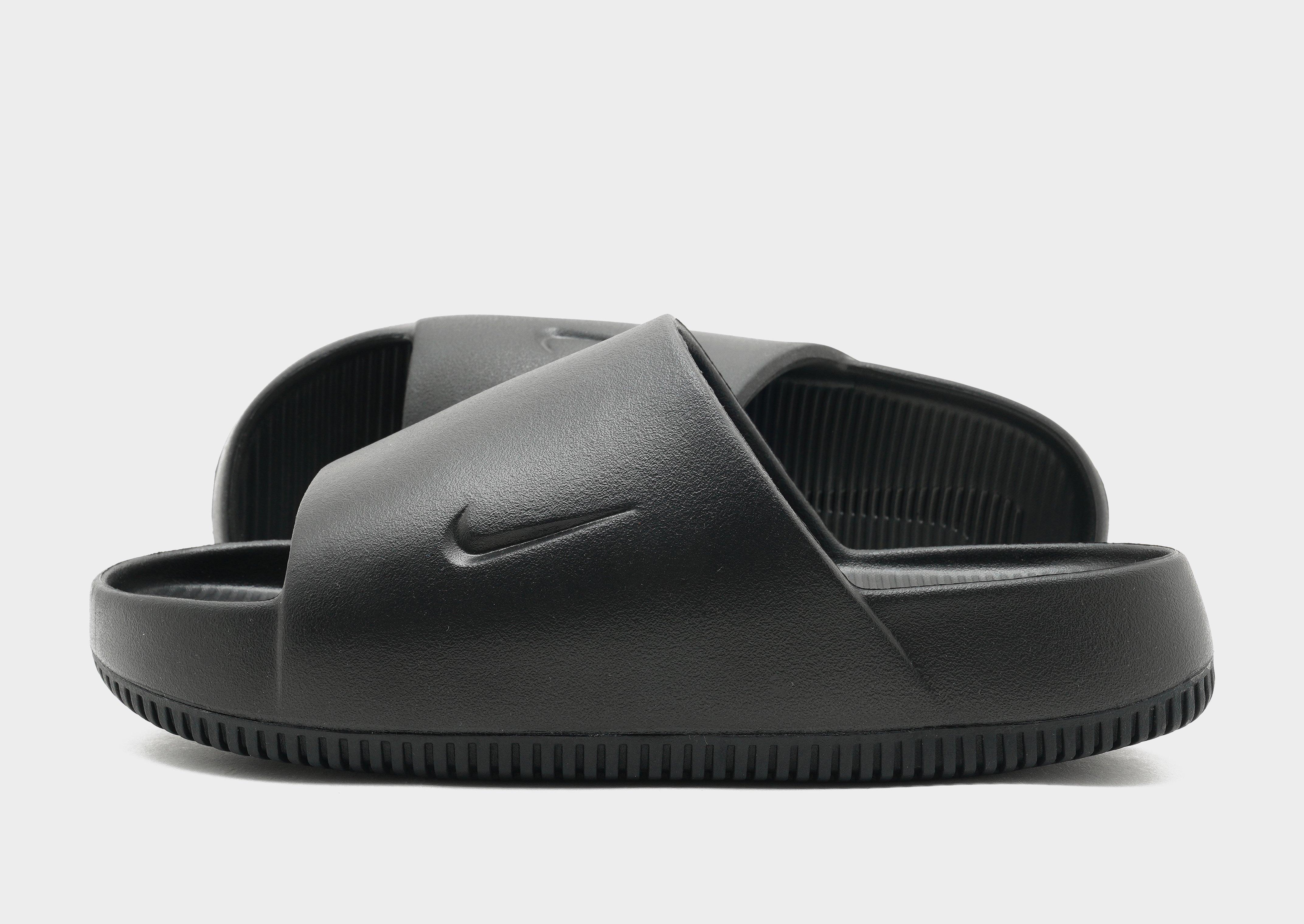 Black and grey nike slides online