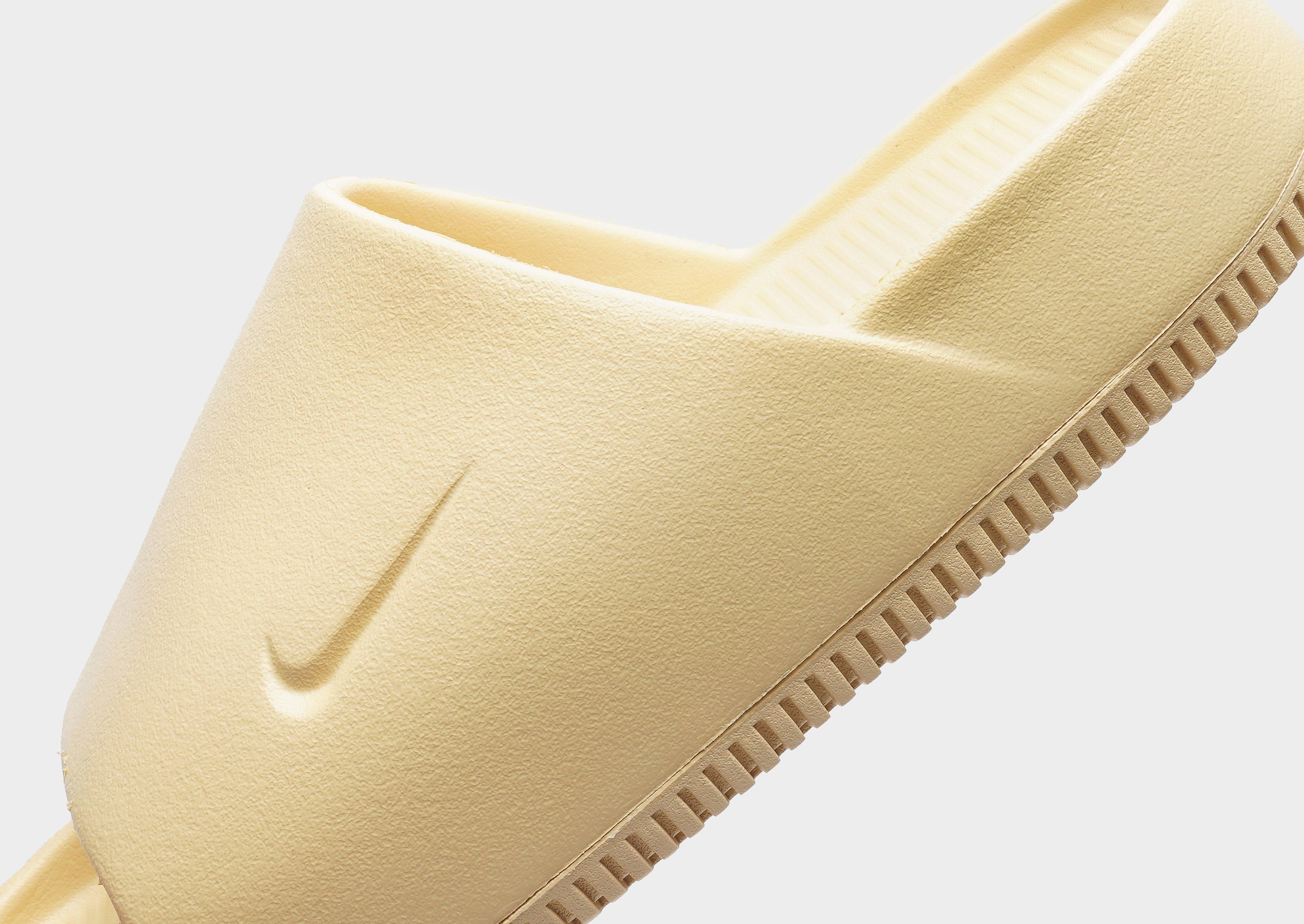 Gold nike hot sale slides womens