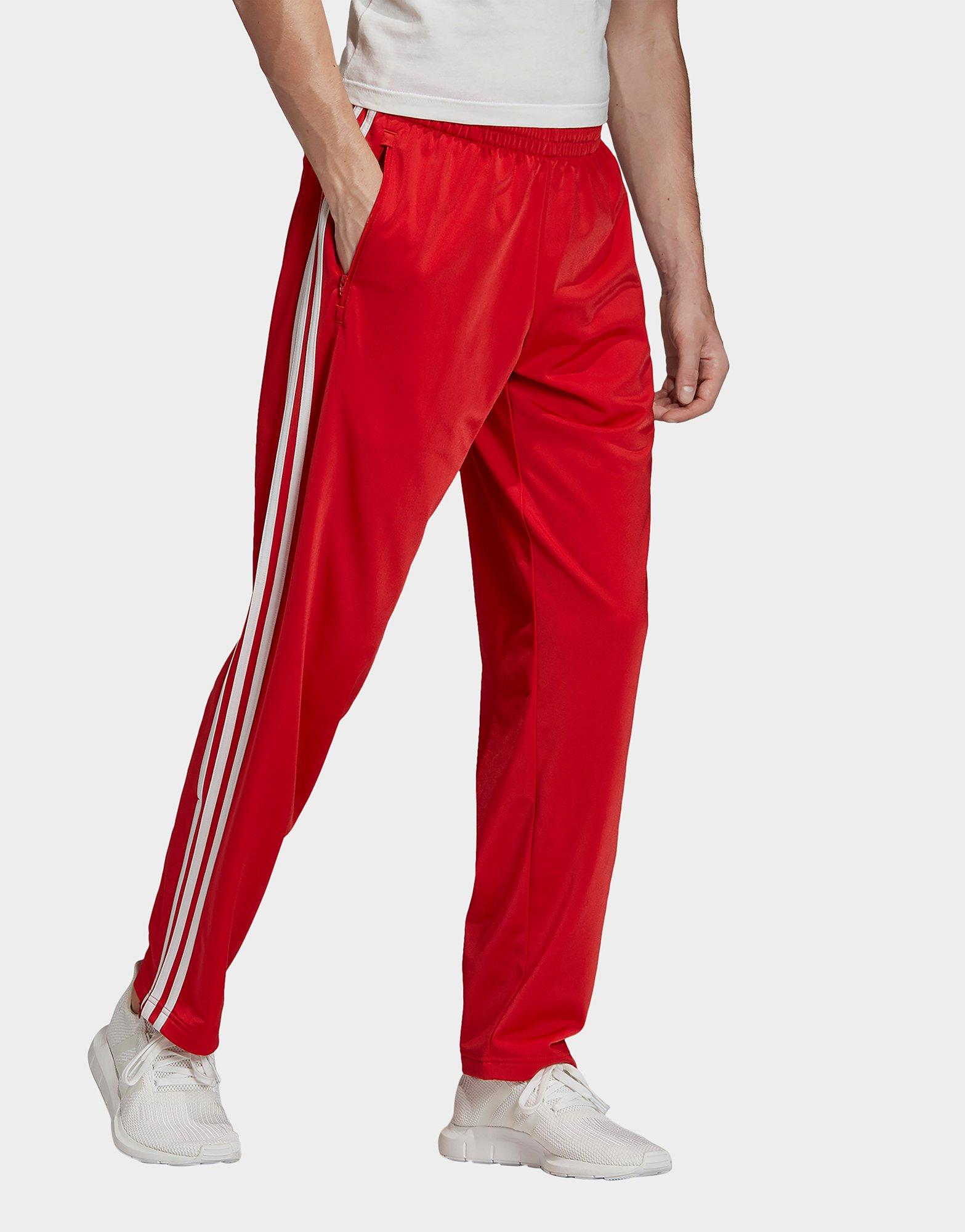 grey and red adidas tracksuit bottoms