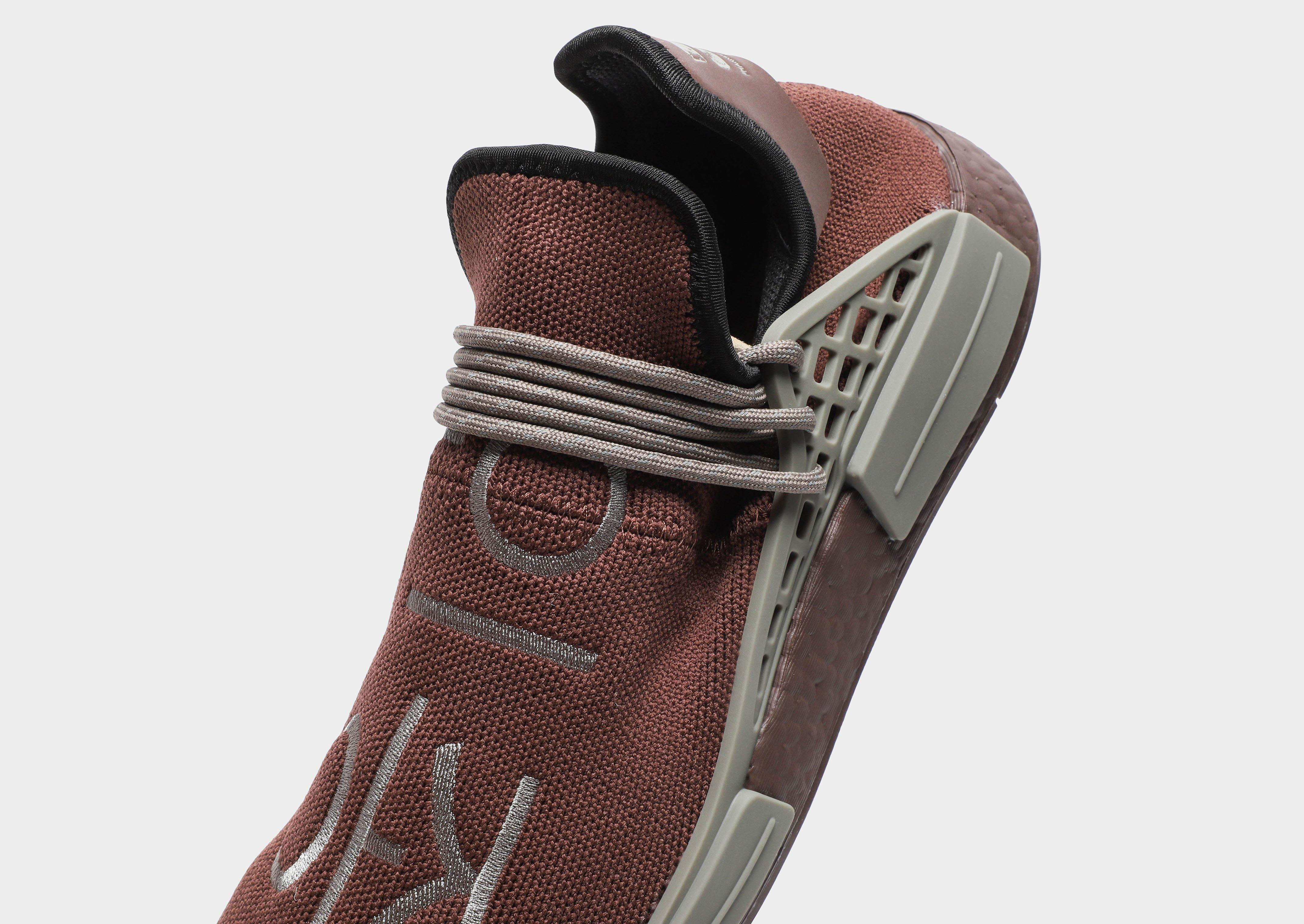 human race shoes brown