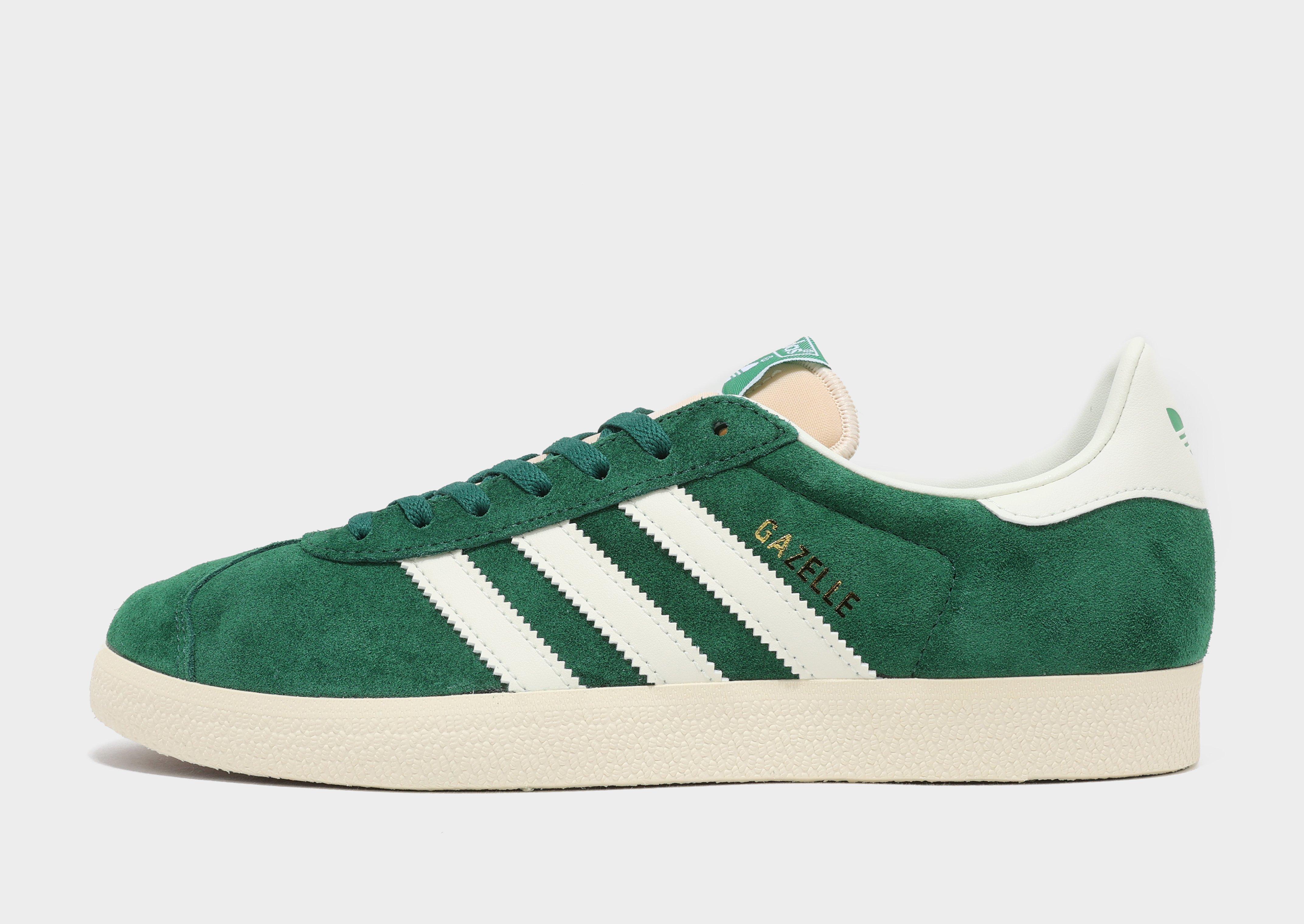 White adidas with green on sale logo