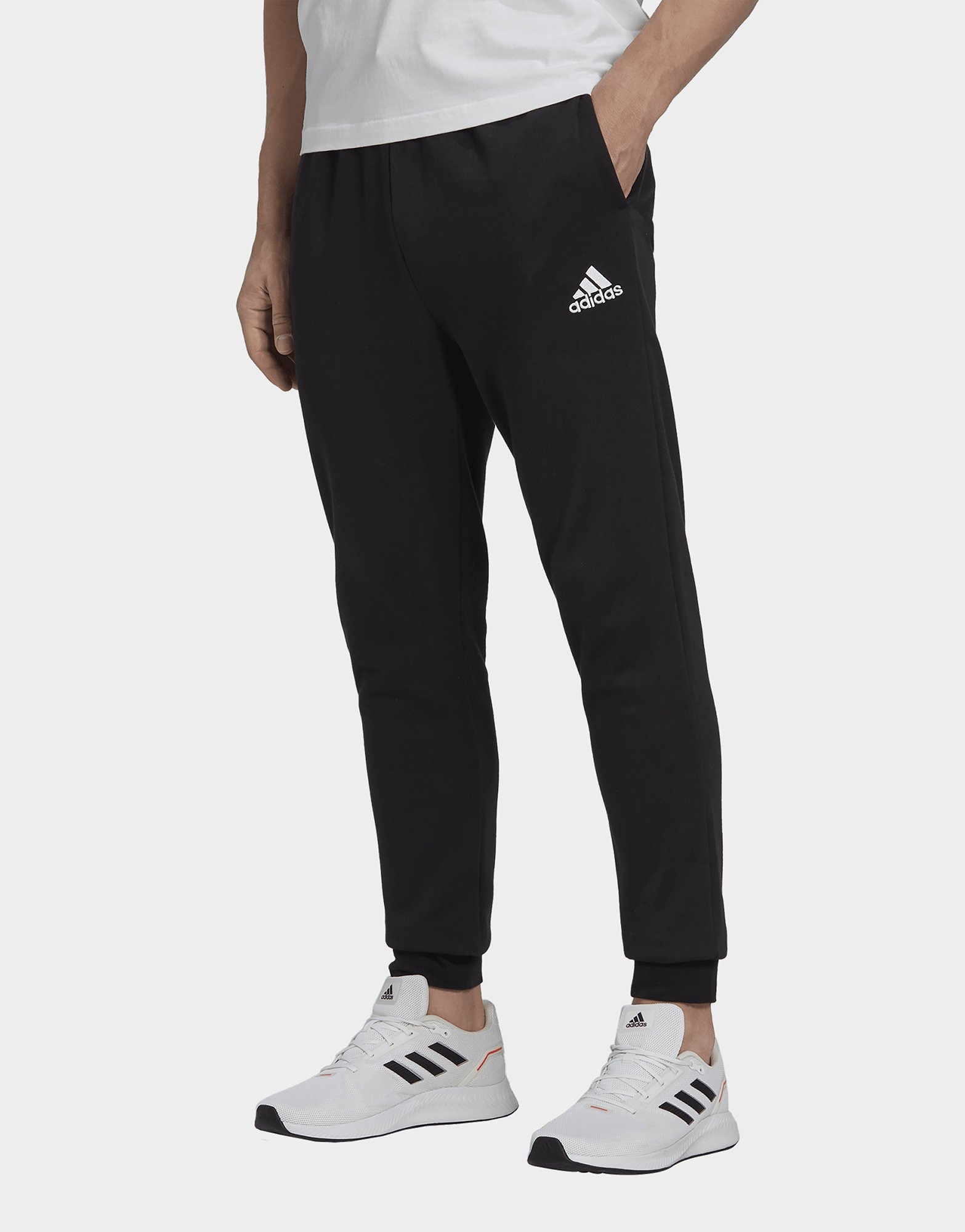 Black adidas Essentials Fleece Regular Tapered Pants | JD Sports UK