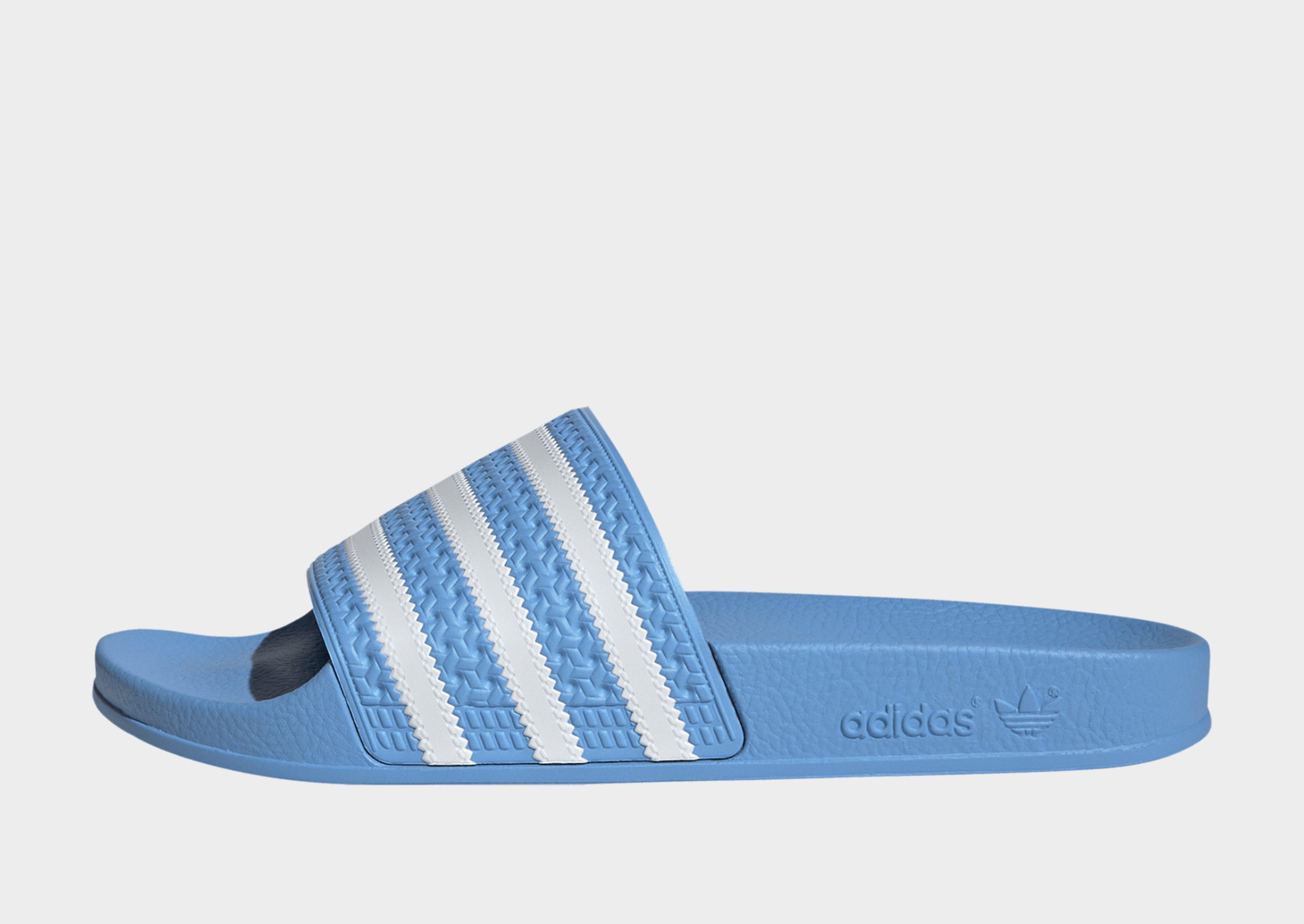 Light blue hotsell adidas slides