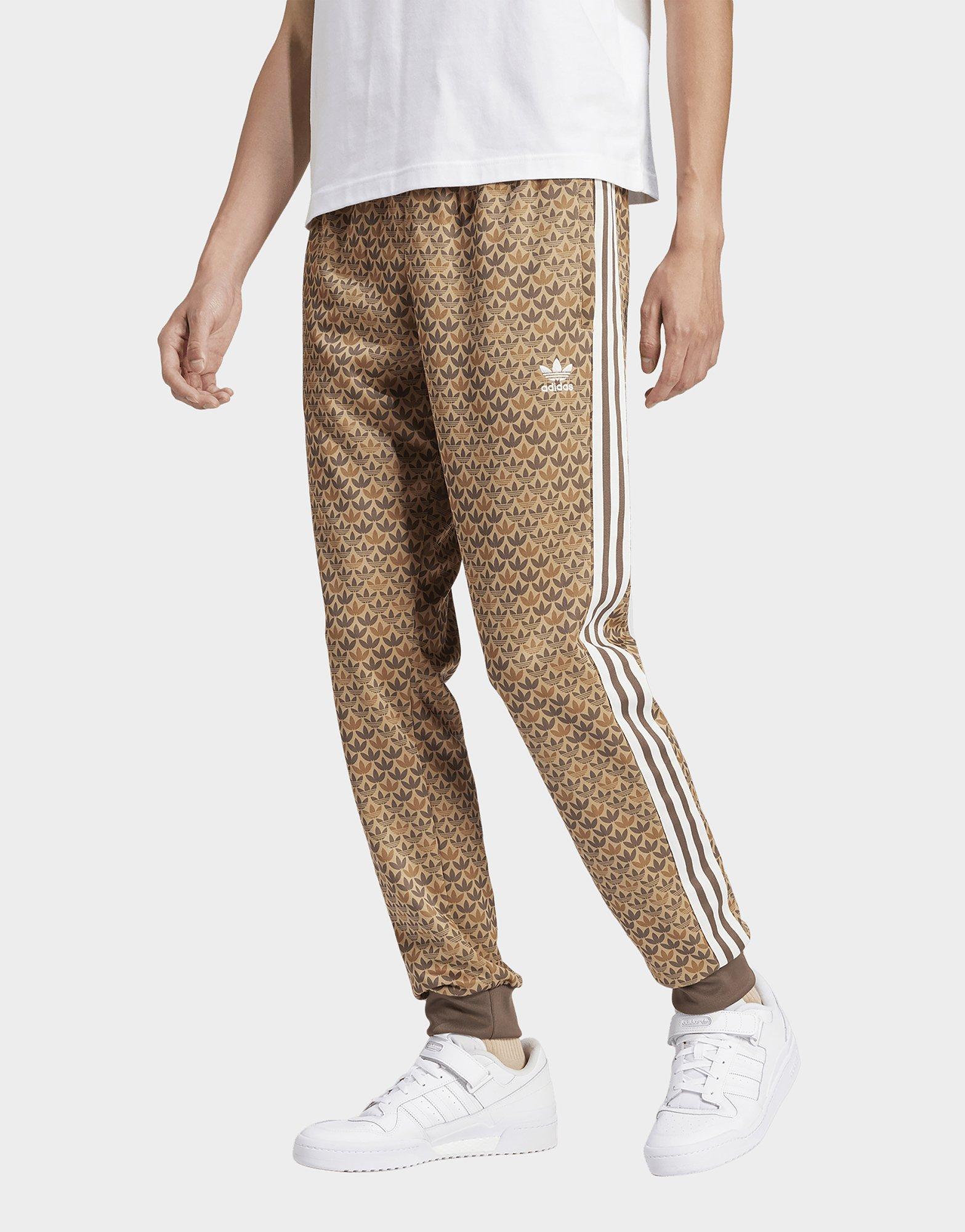 adidas Originals Retro Luxury track pants in brown with monogram print