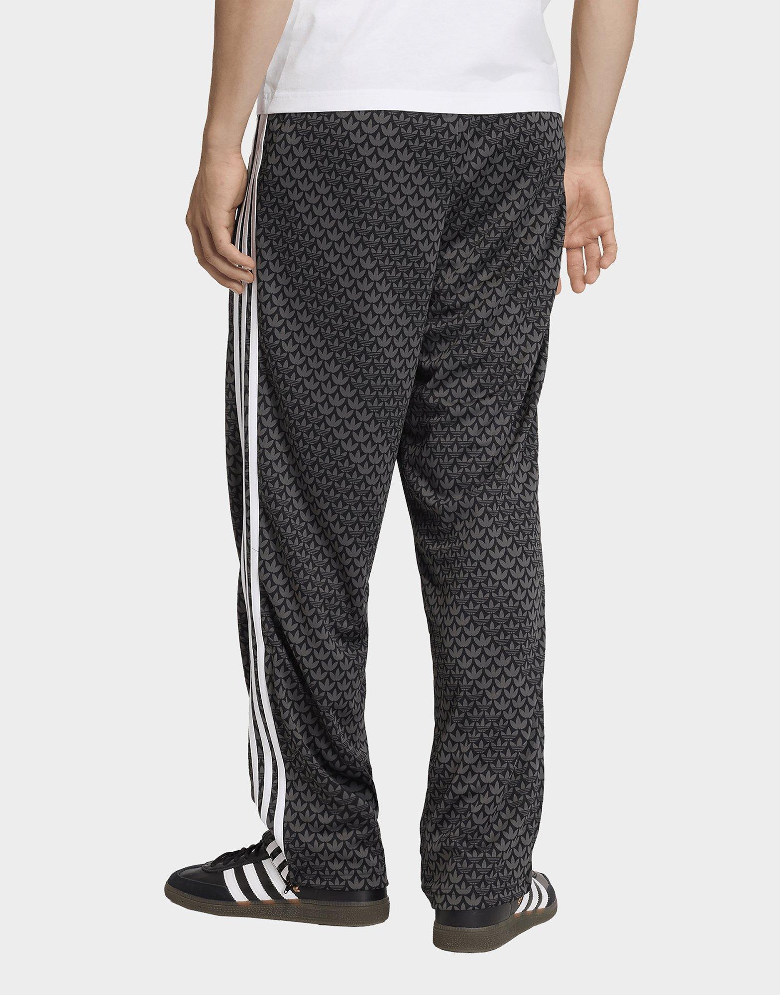 adidas PANTALÓN DE CHÁNDAL FIREBIRD LOOSE MONOGRAM